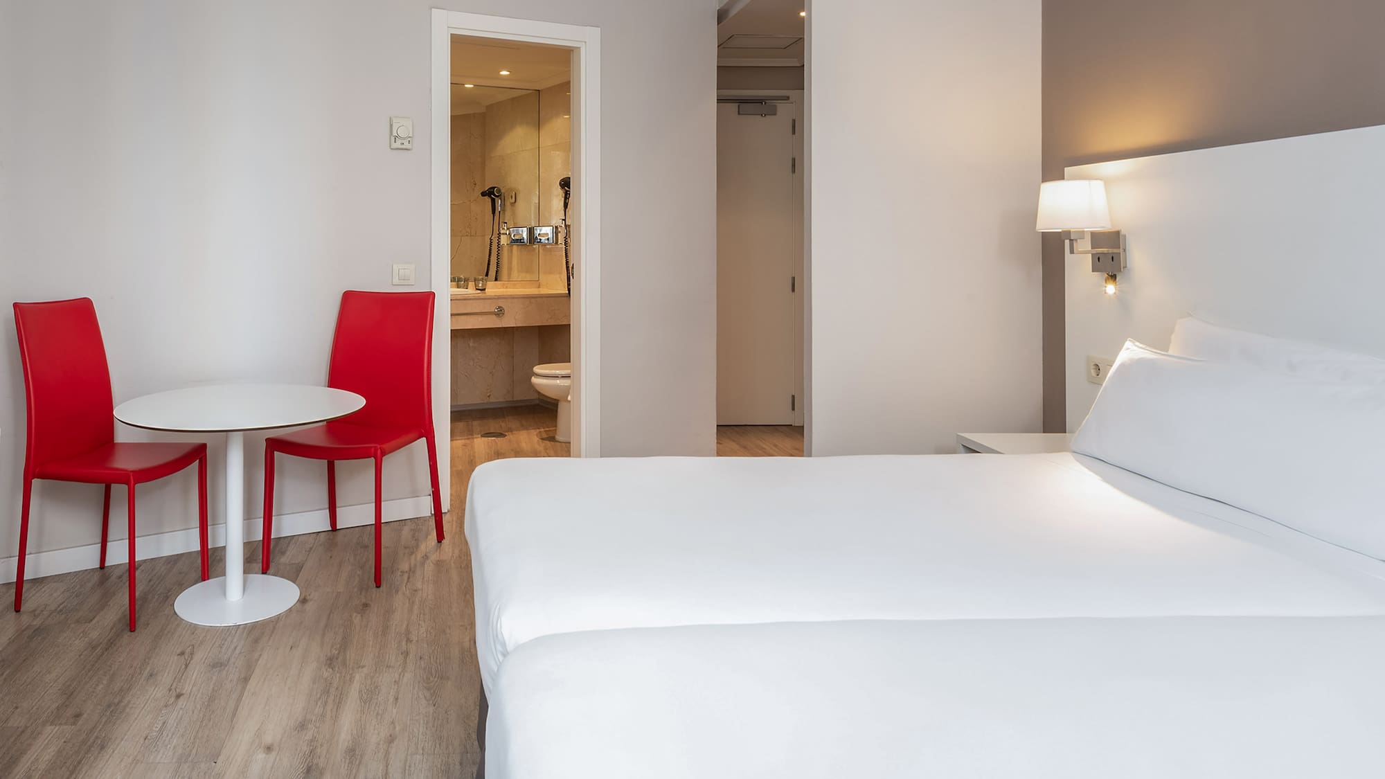 a room with a table and chairs