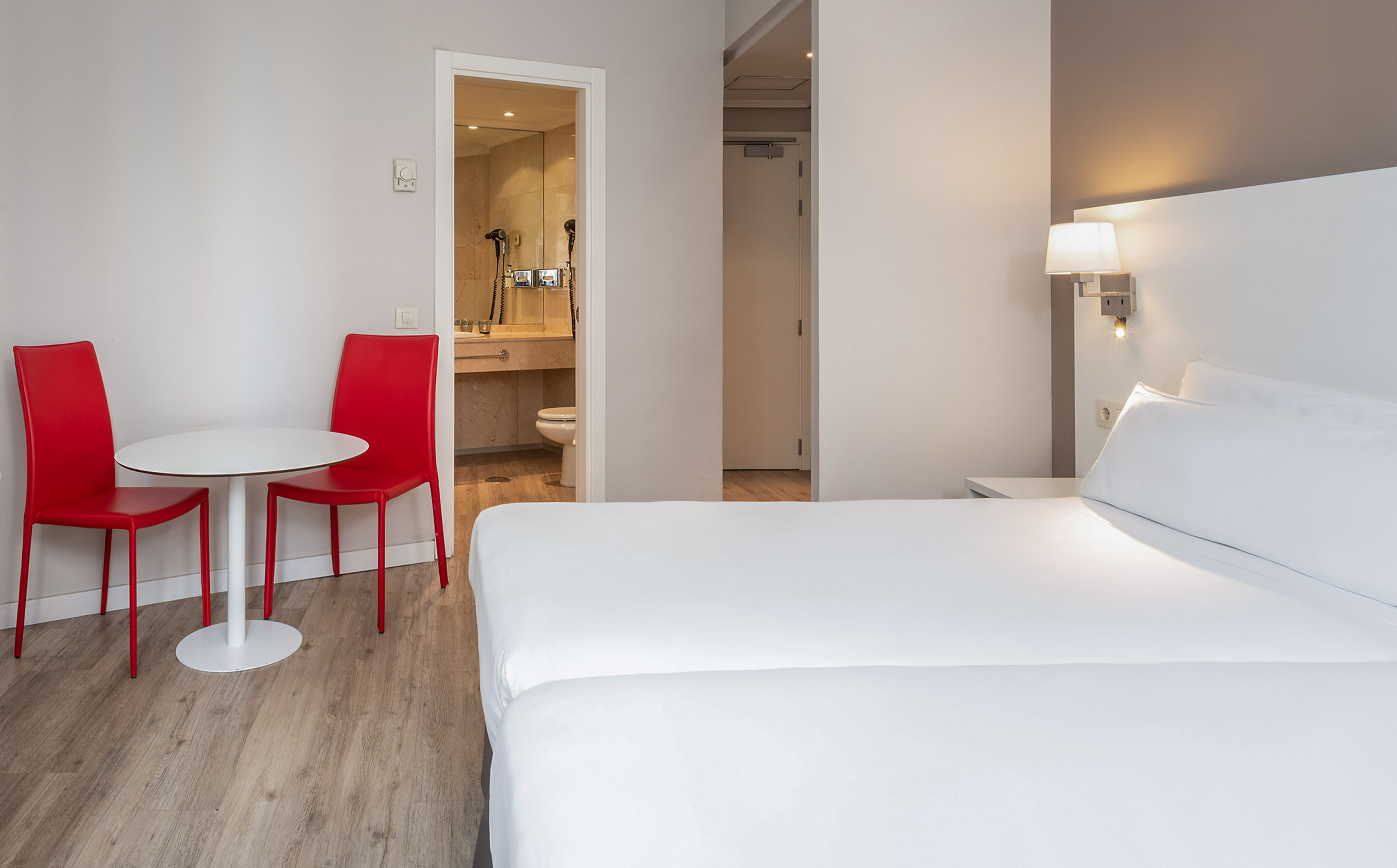 a room with a table and chairs