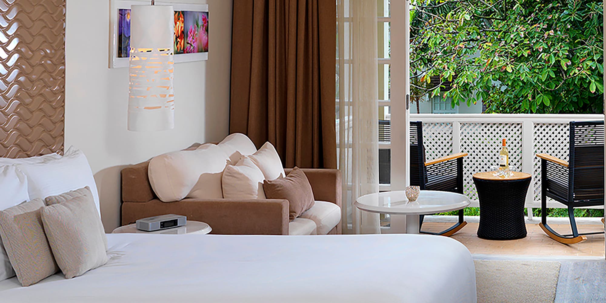 a room with two beds and a patio