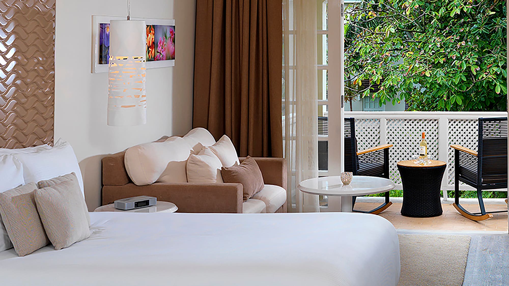 a room with two beds and a patio