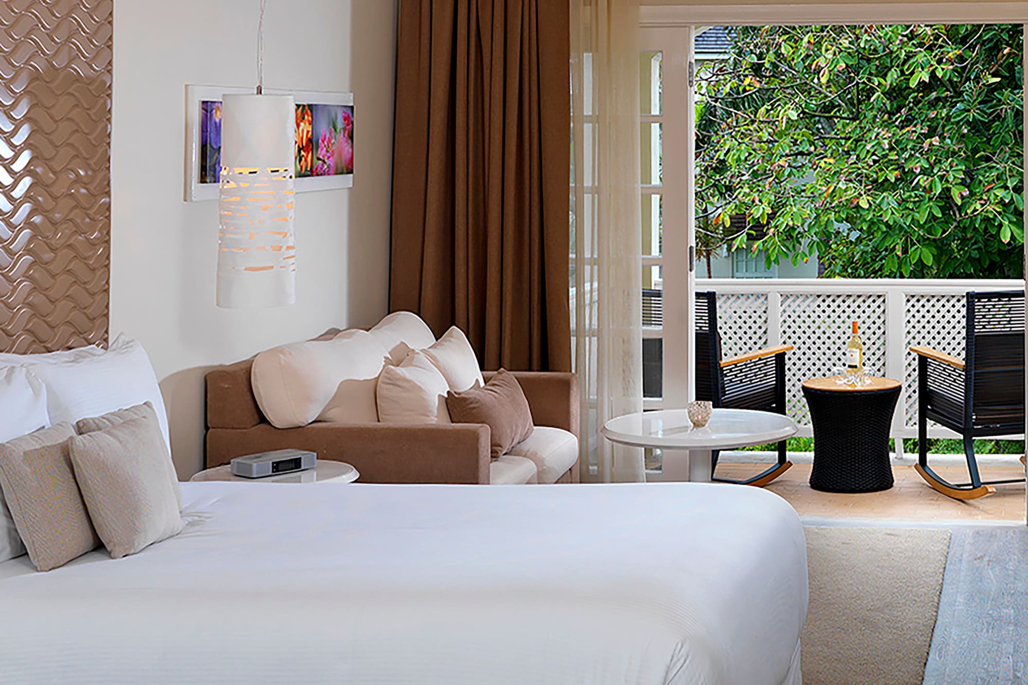 a room with two beds and a patio