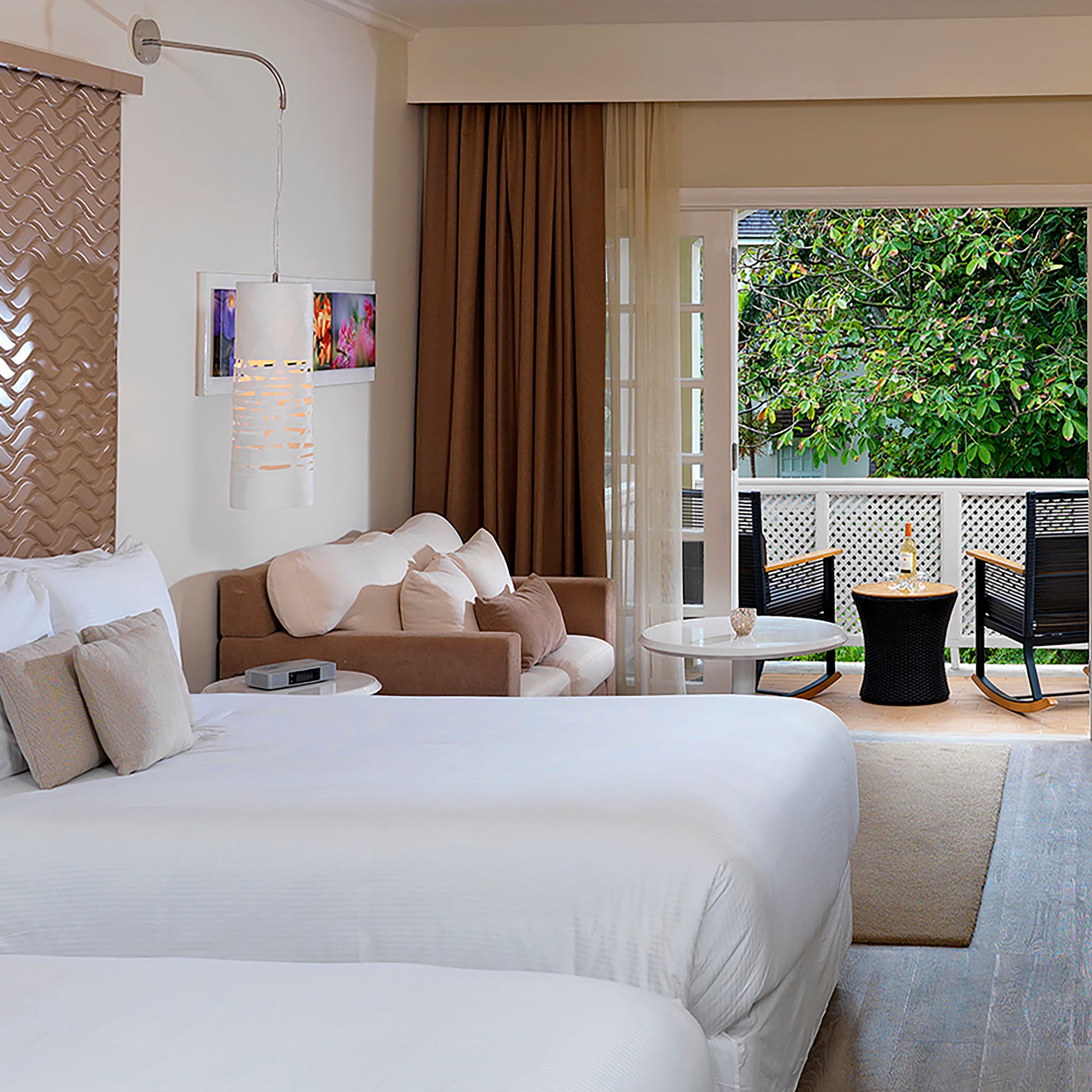 a room with two beds and a patio