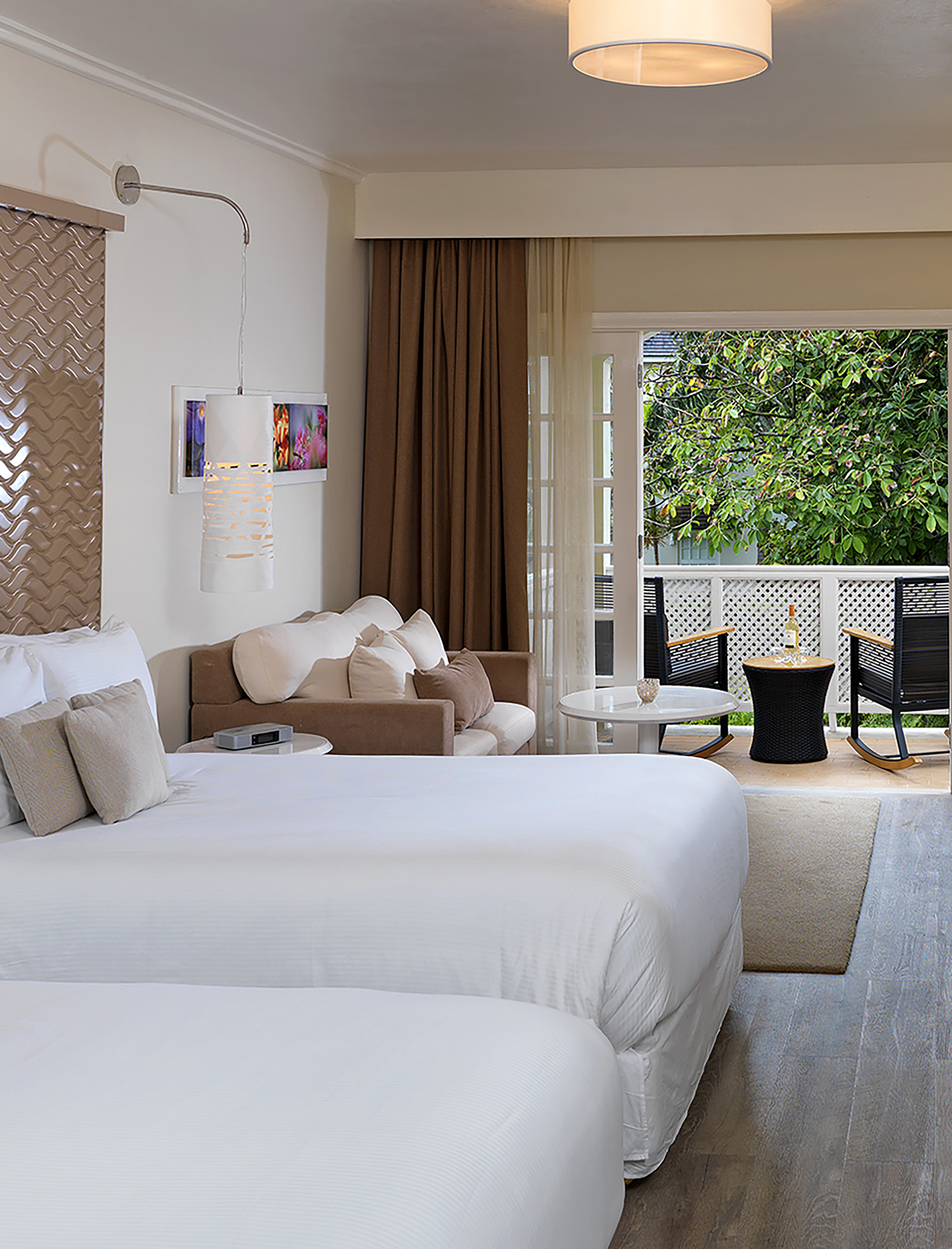 a room with two beds and a patio