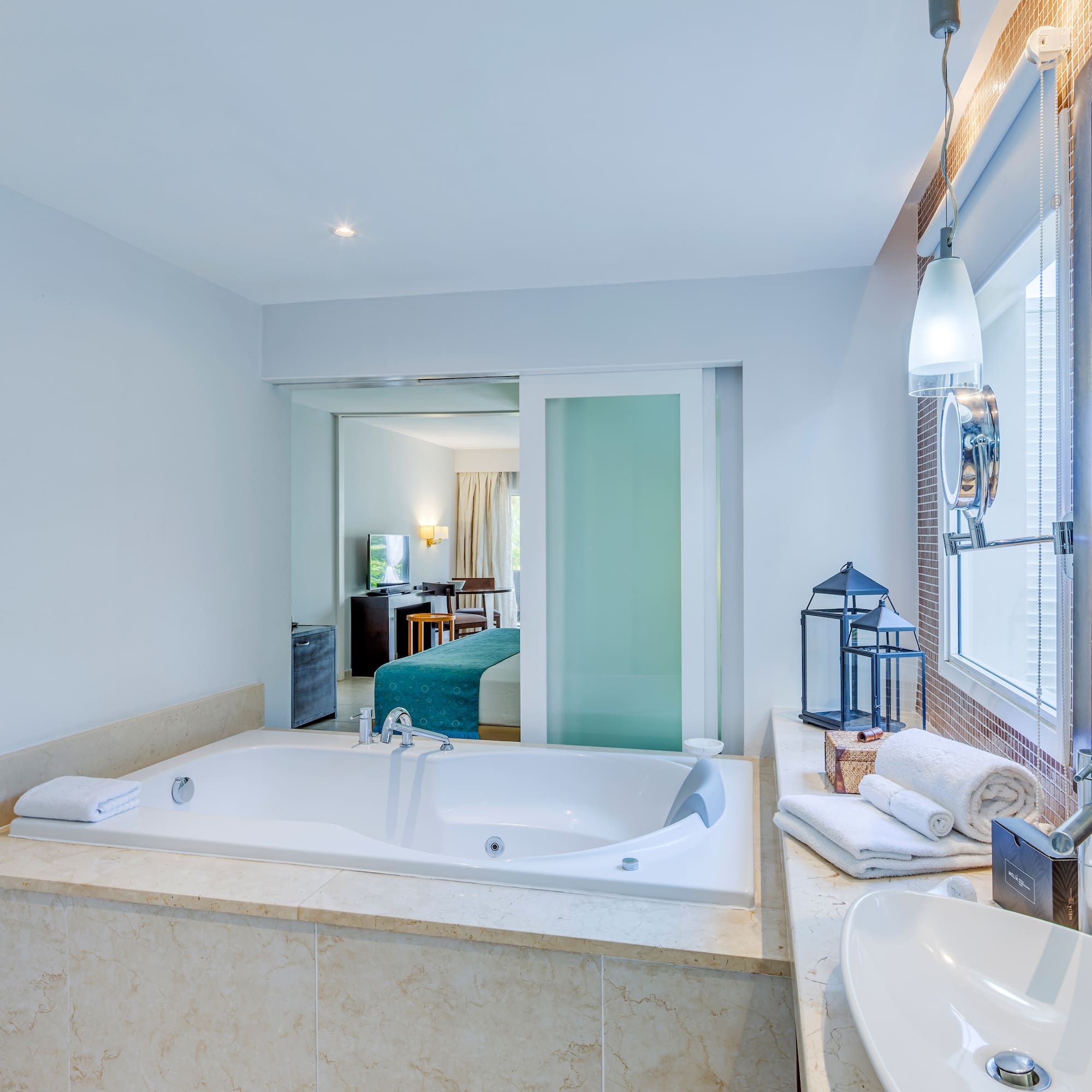 a bathroom with a bathtub and sink