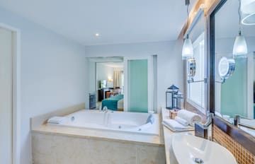 a bathroom with a bathtub and sink