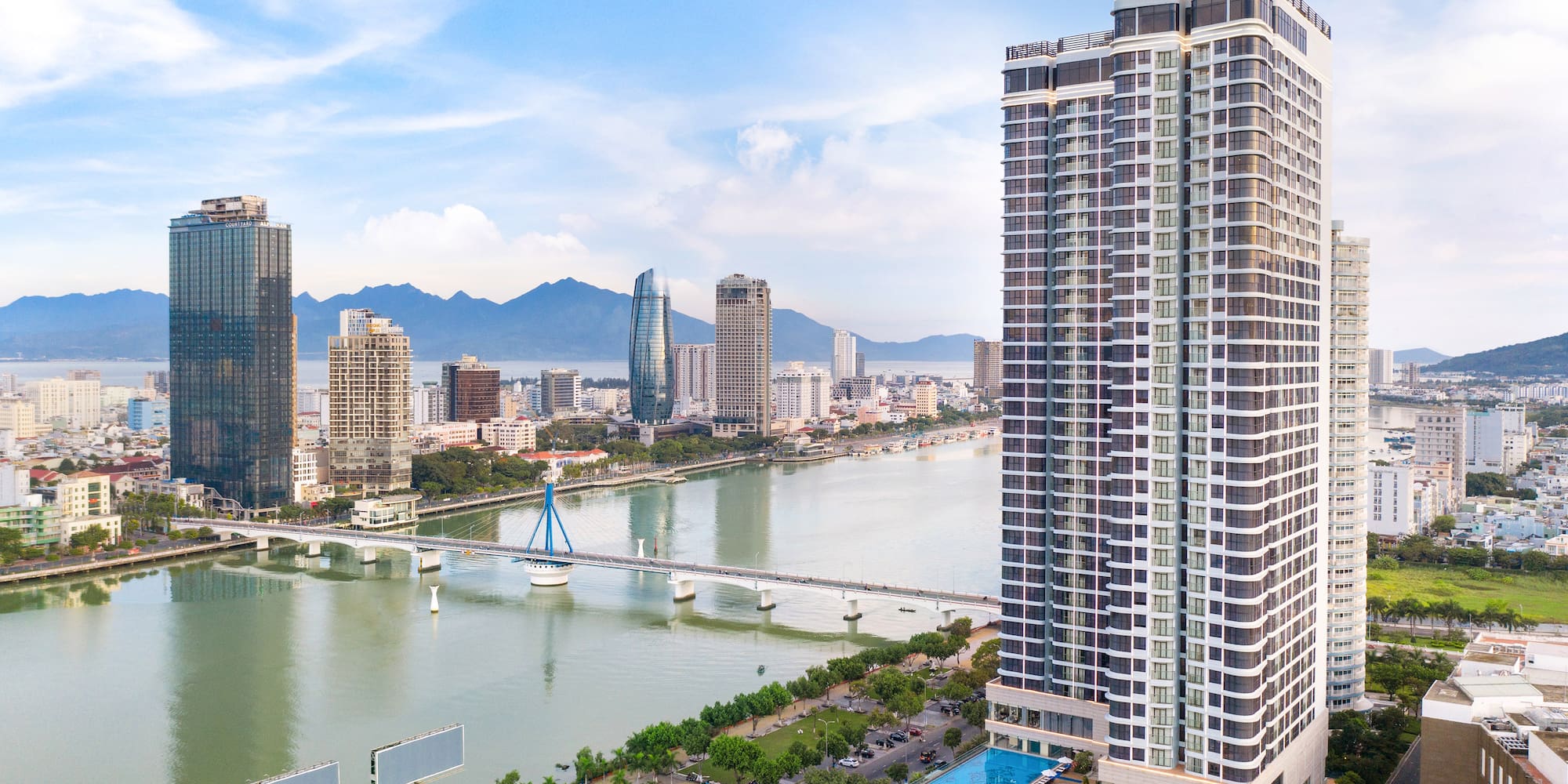 a city with a bridge and a river