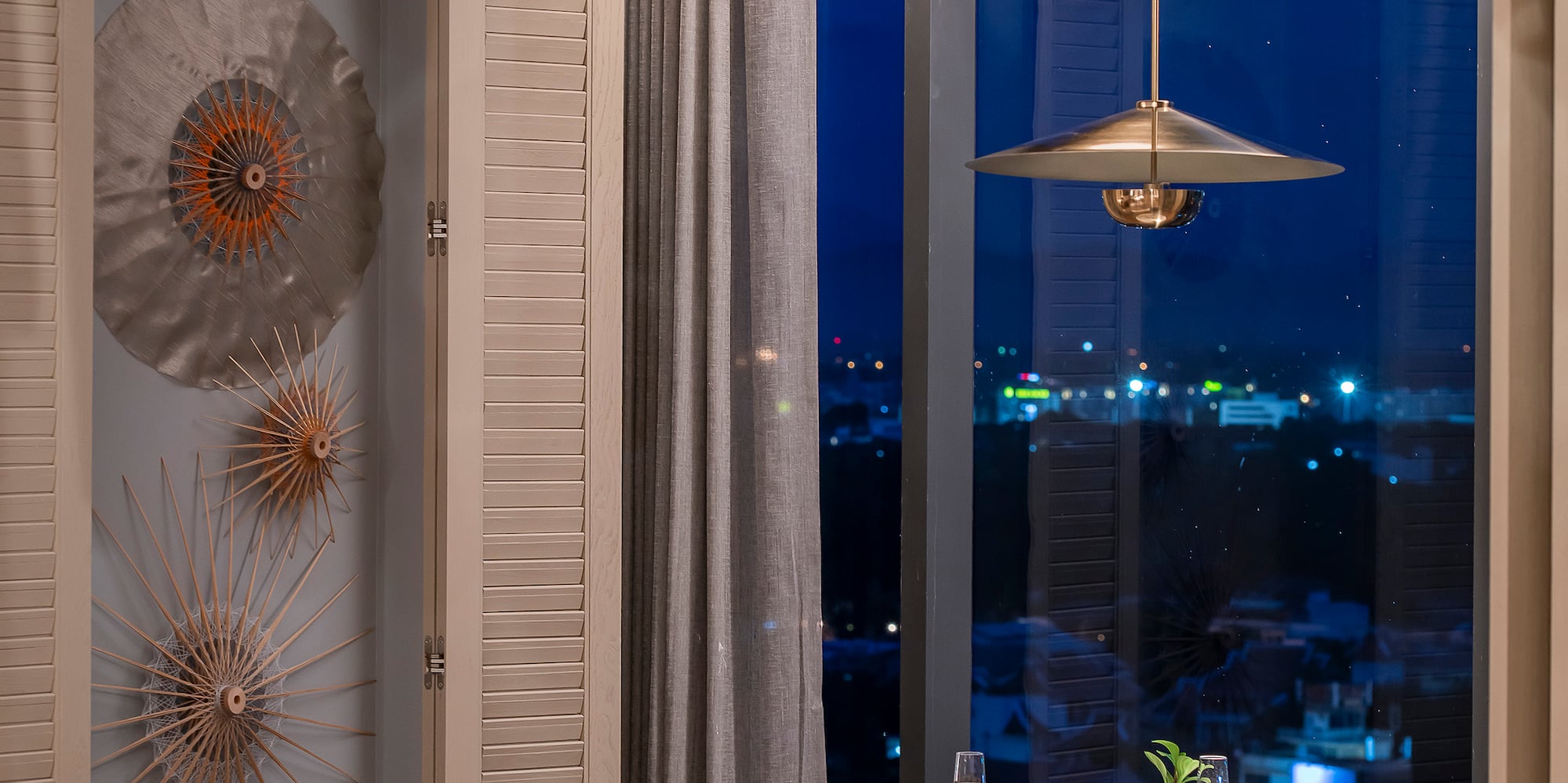 a dining room with a table and chairs