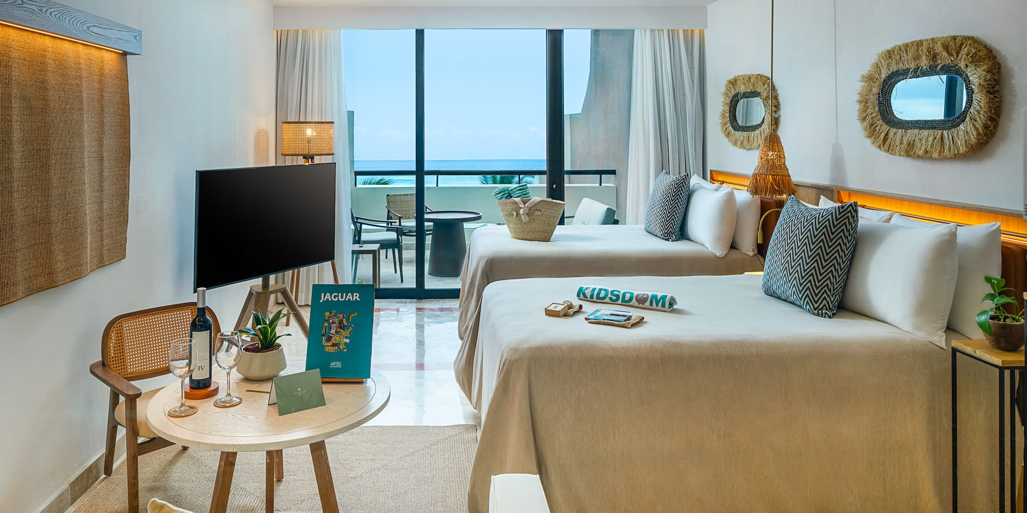 a room with two beds and a television