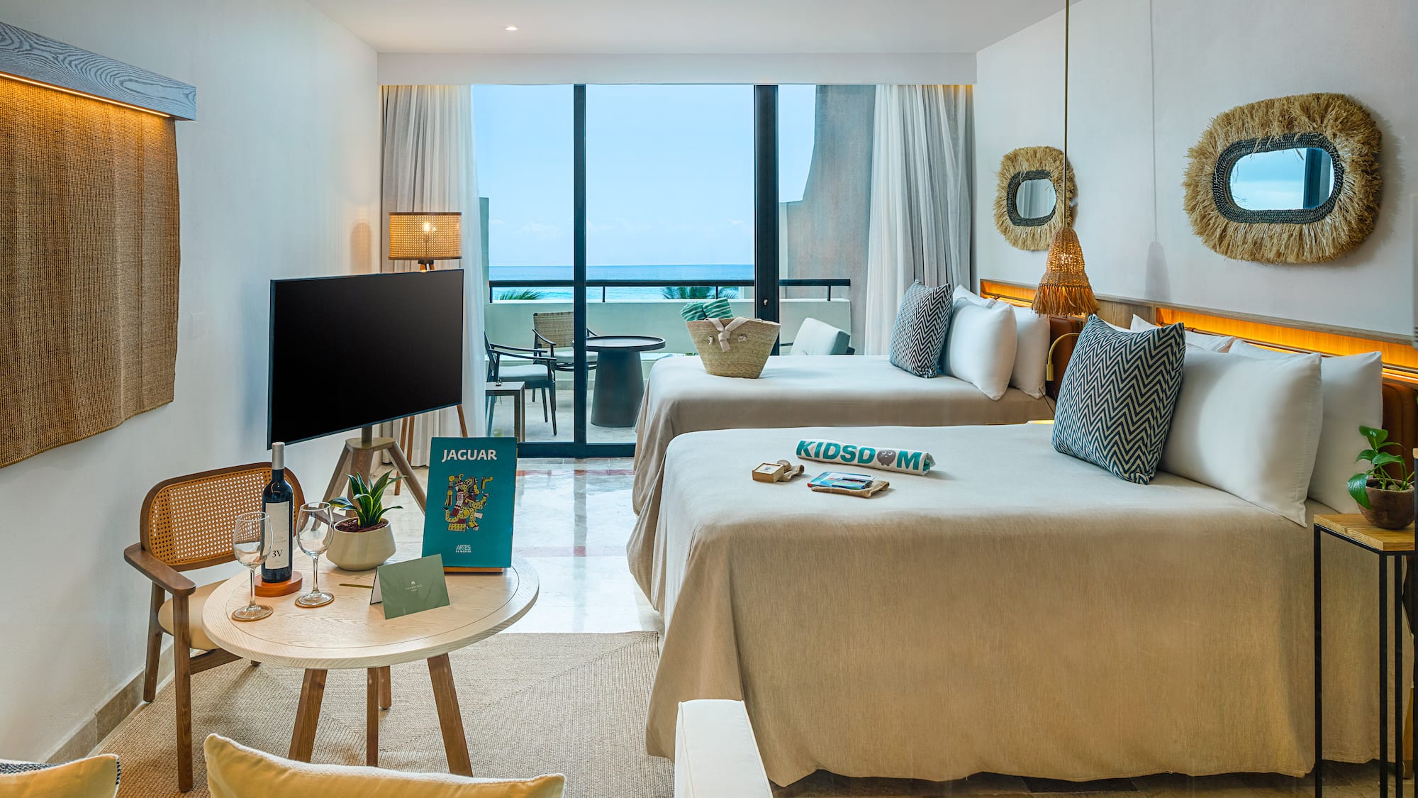 a room with two beds and a television