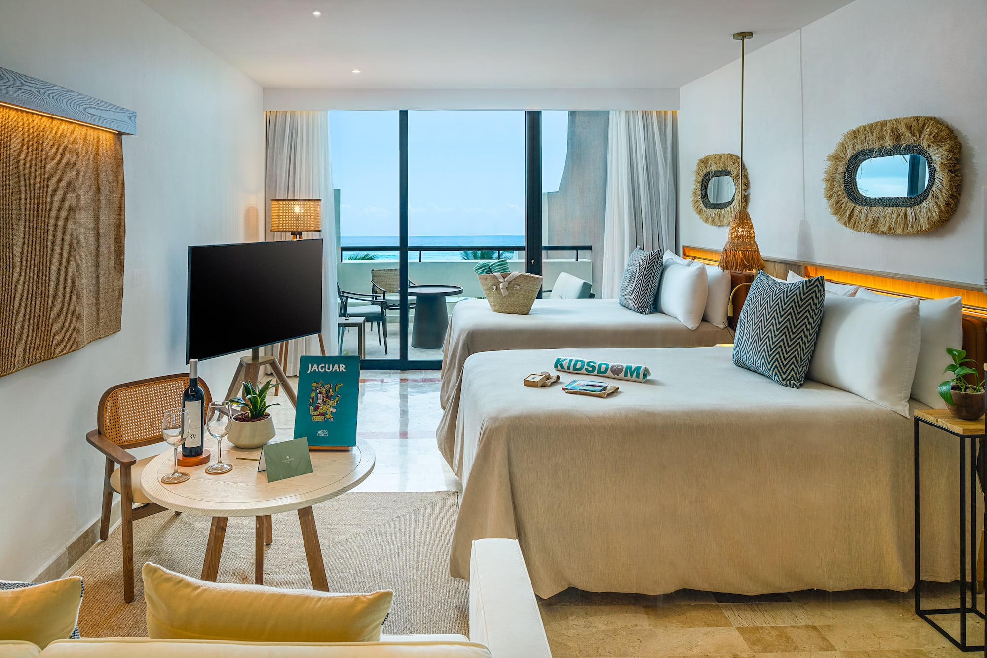 a room with two beds and a television