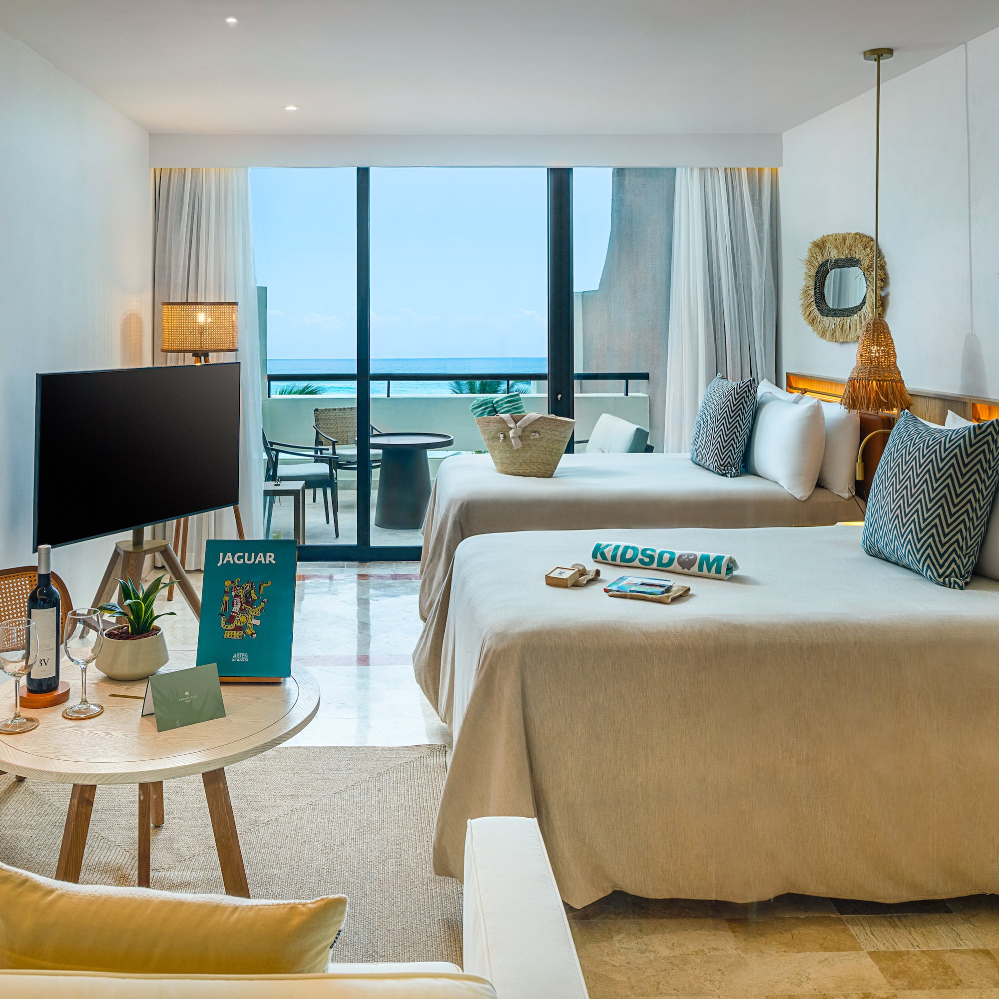 a room with two beds and a television