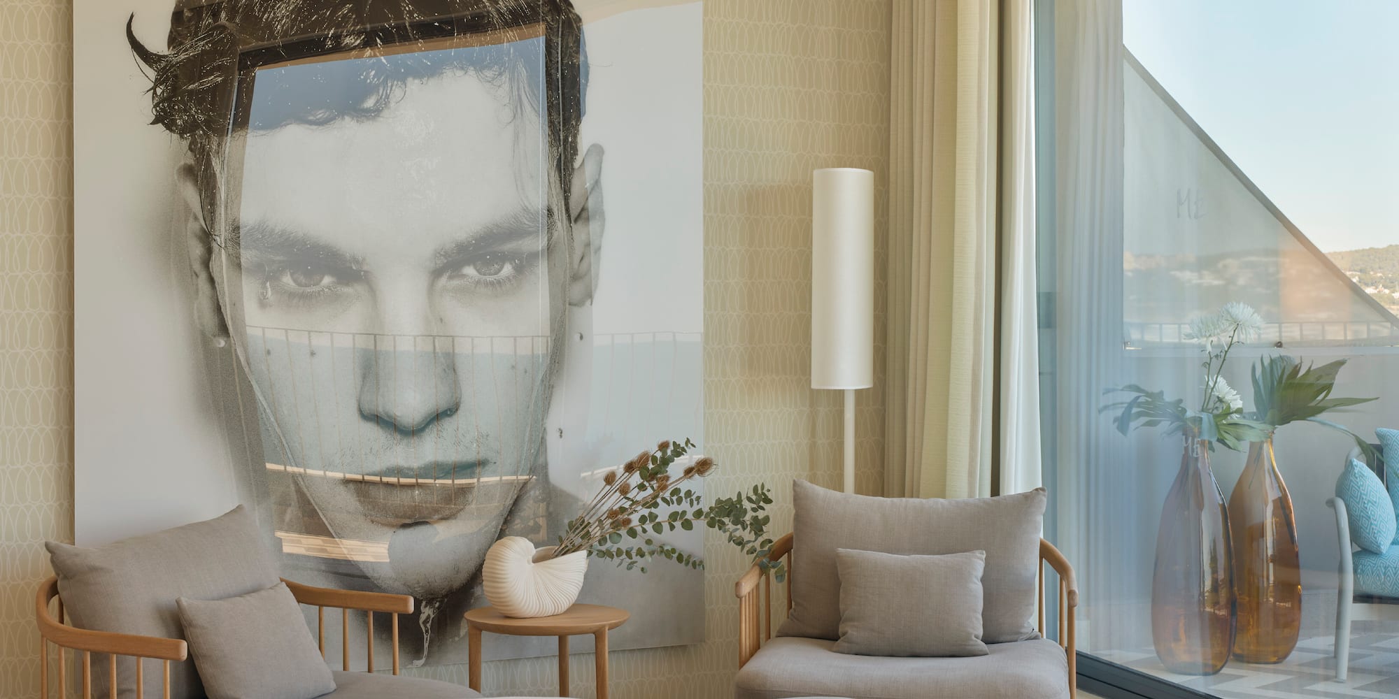a bedroom with a large poster of a man's face