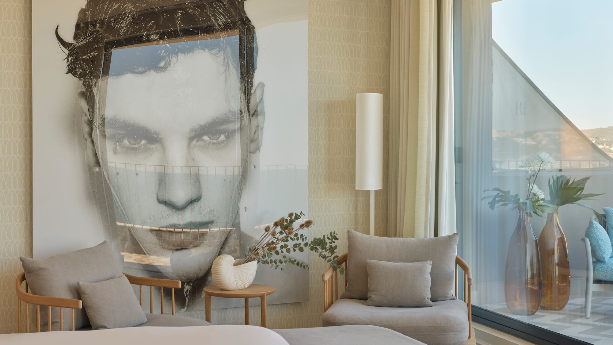 a bedroom with a large poster of a man's face