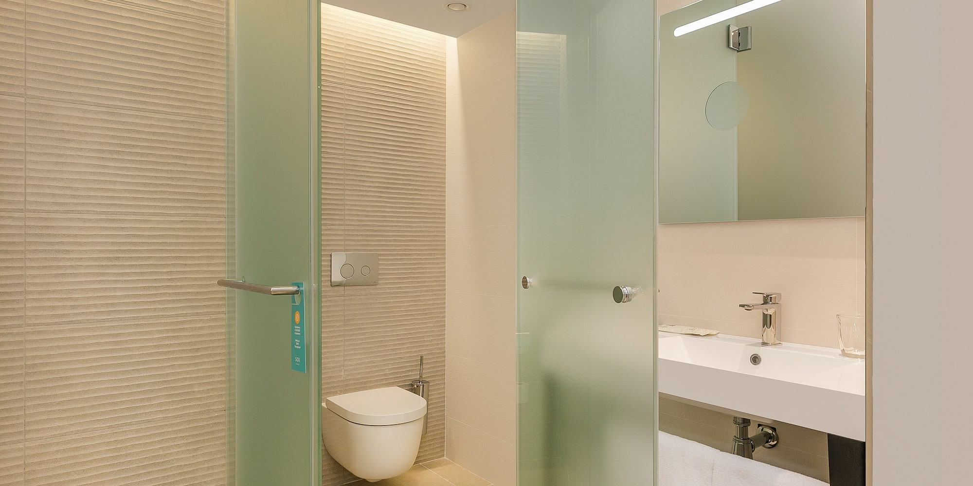 a bathroom with a glass door