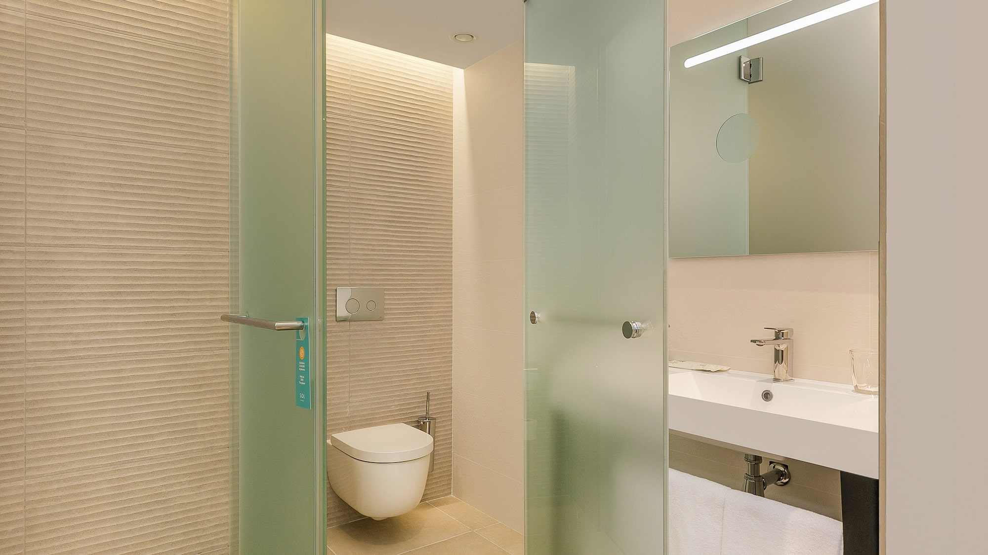 a bathroom with a glass door