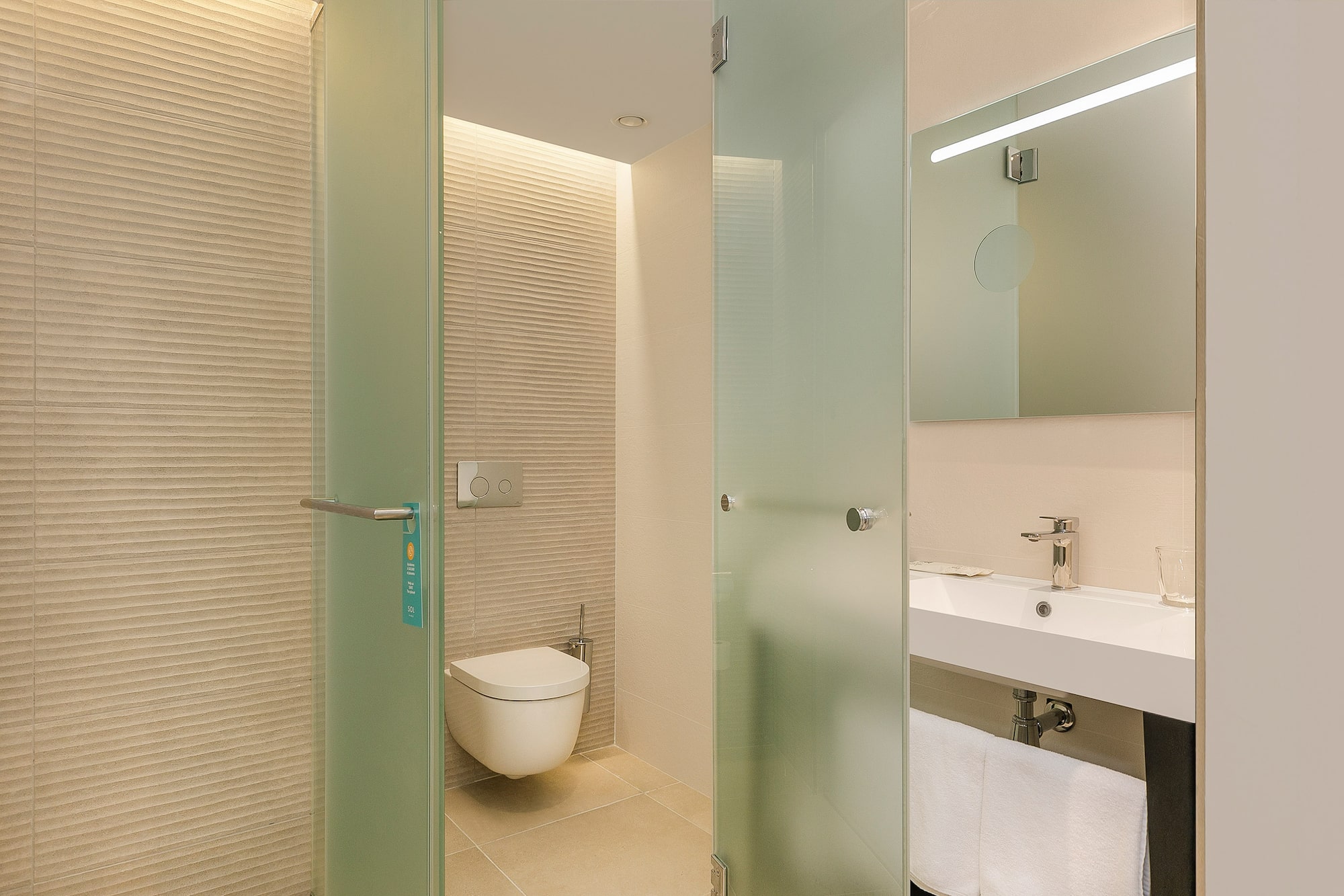 a bathroom with a glass door