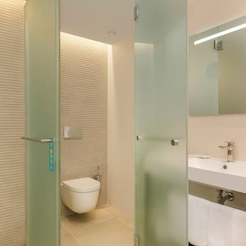 a bathroom with a glass door