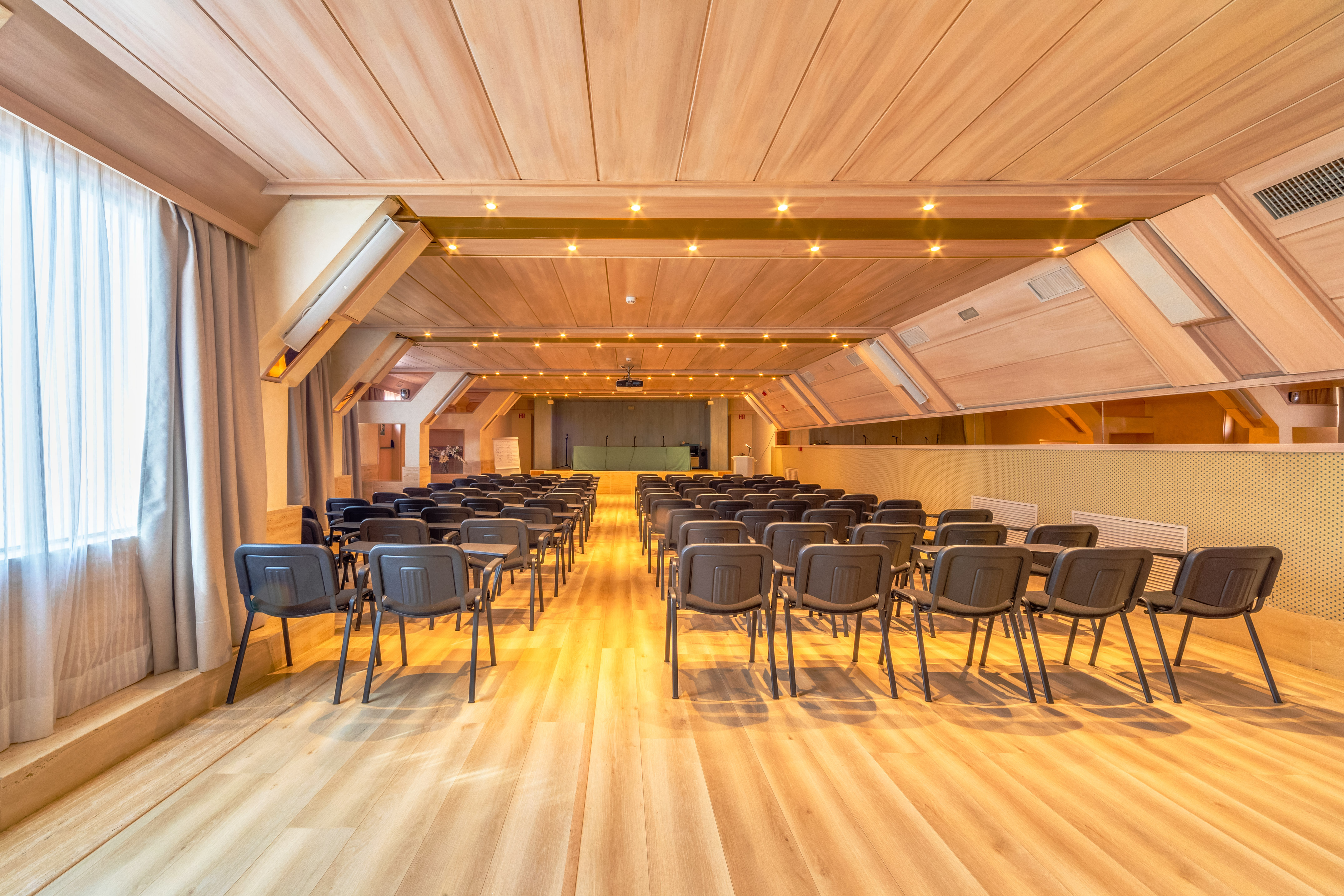 a room with rows of chairs
