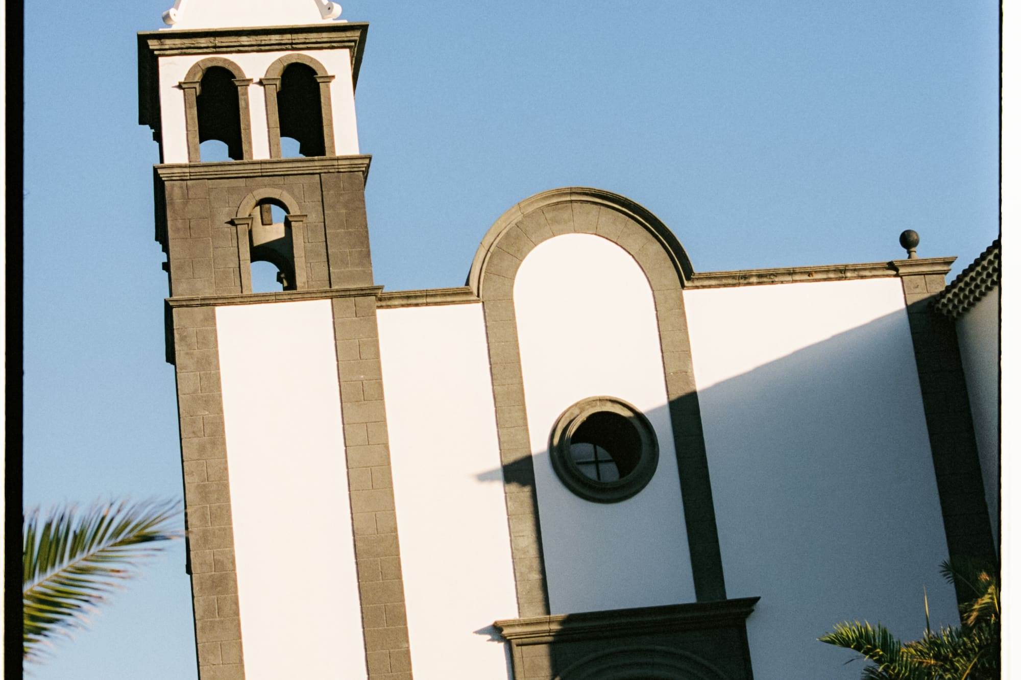 a white building with a bell tower