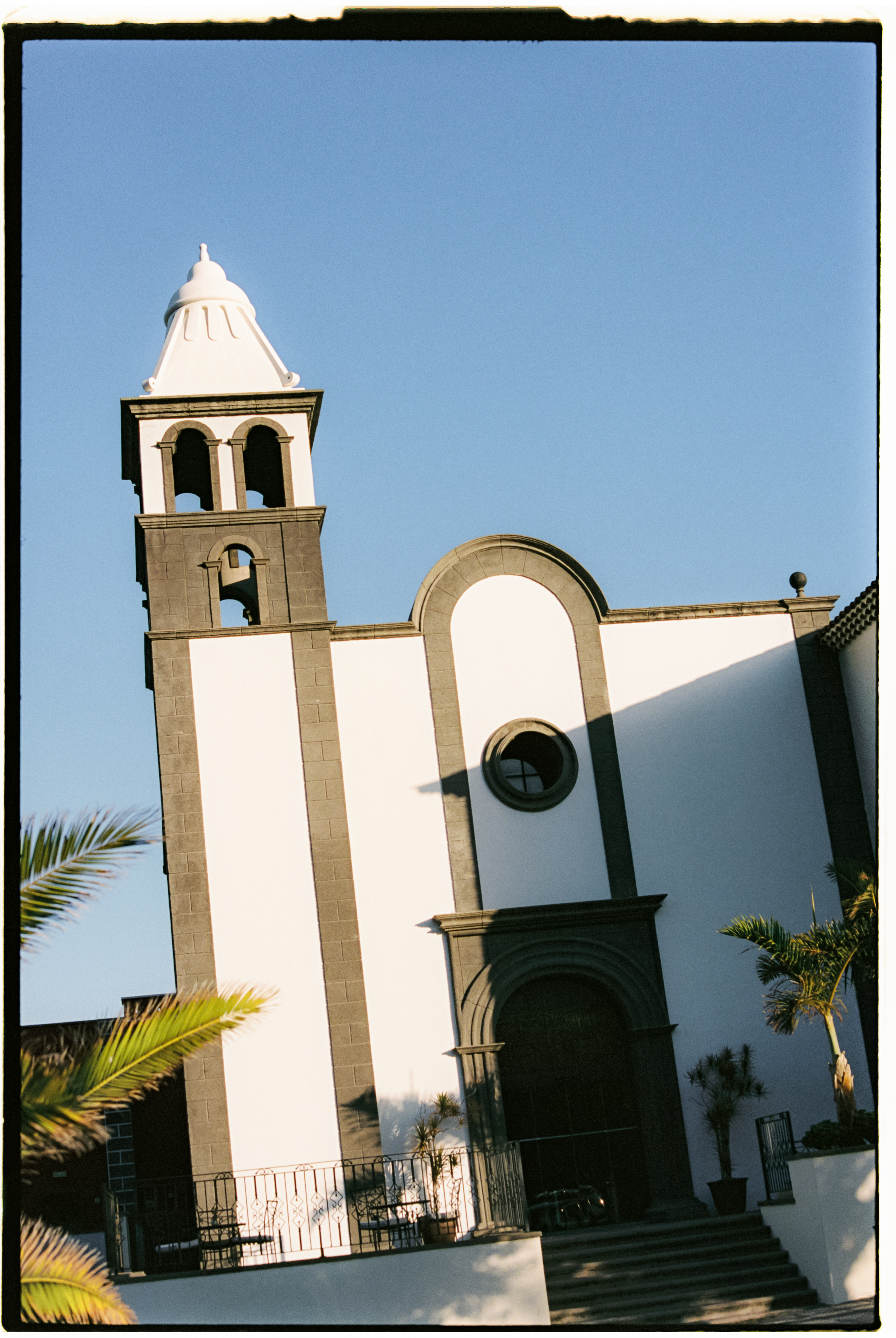 a white building with a bell tower
