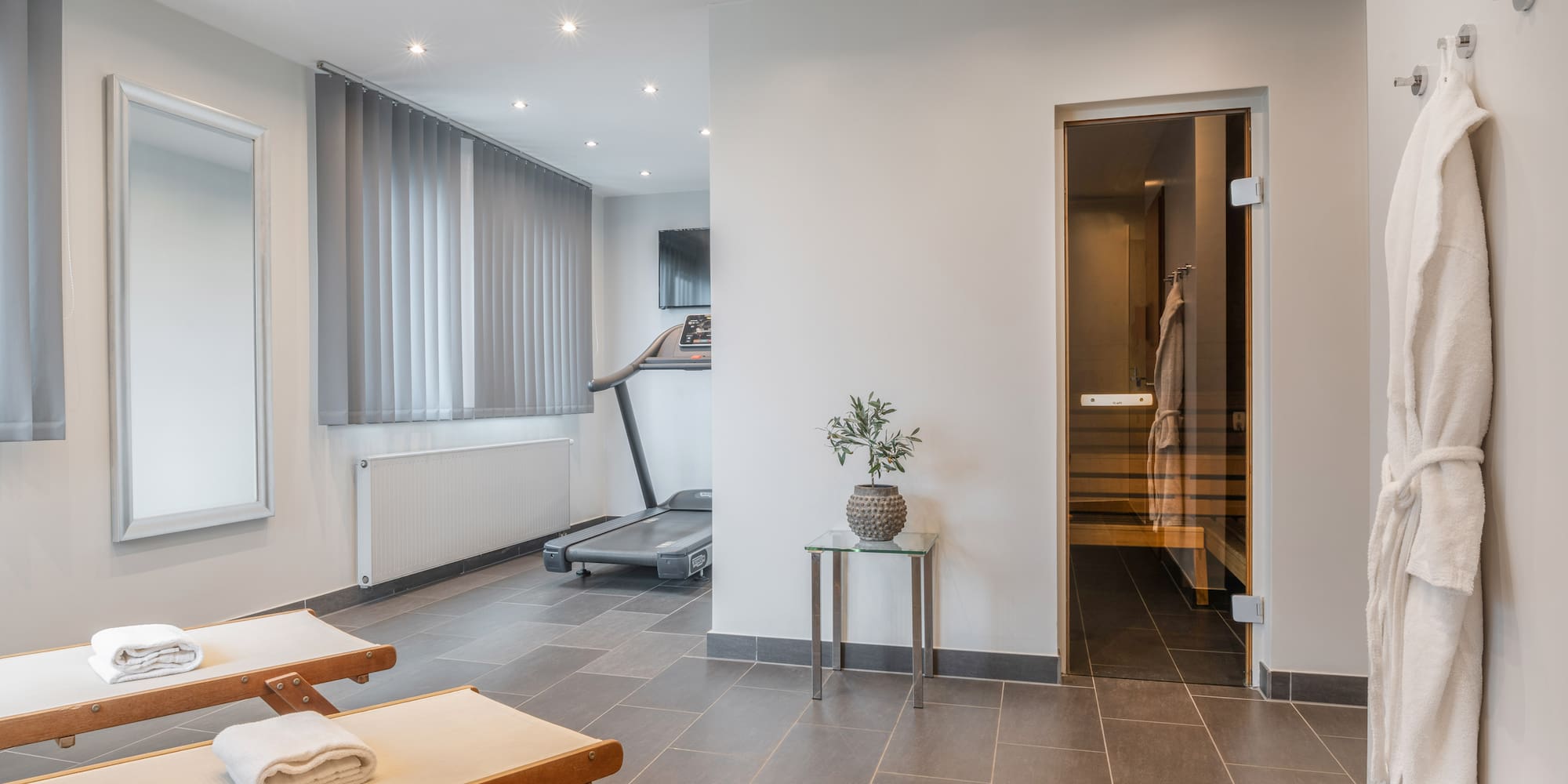 a room with a gym and a towel on the floor