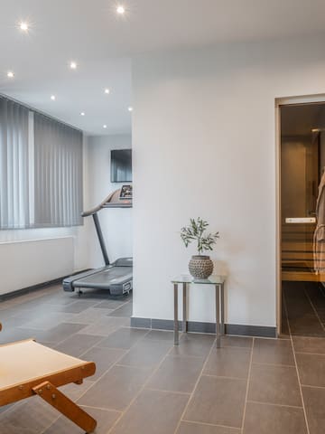 a room with a gym and a towel on the floor