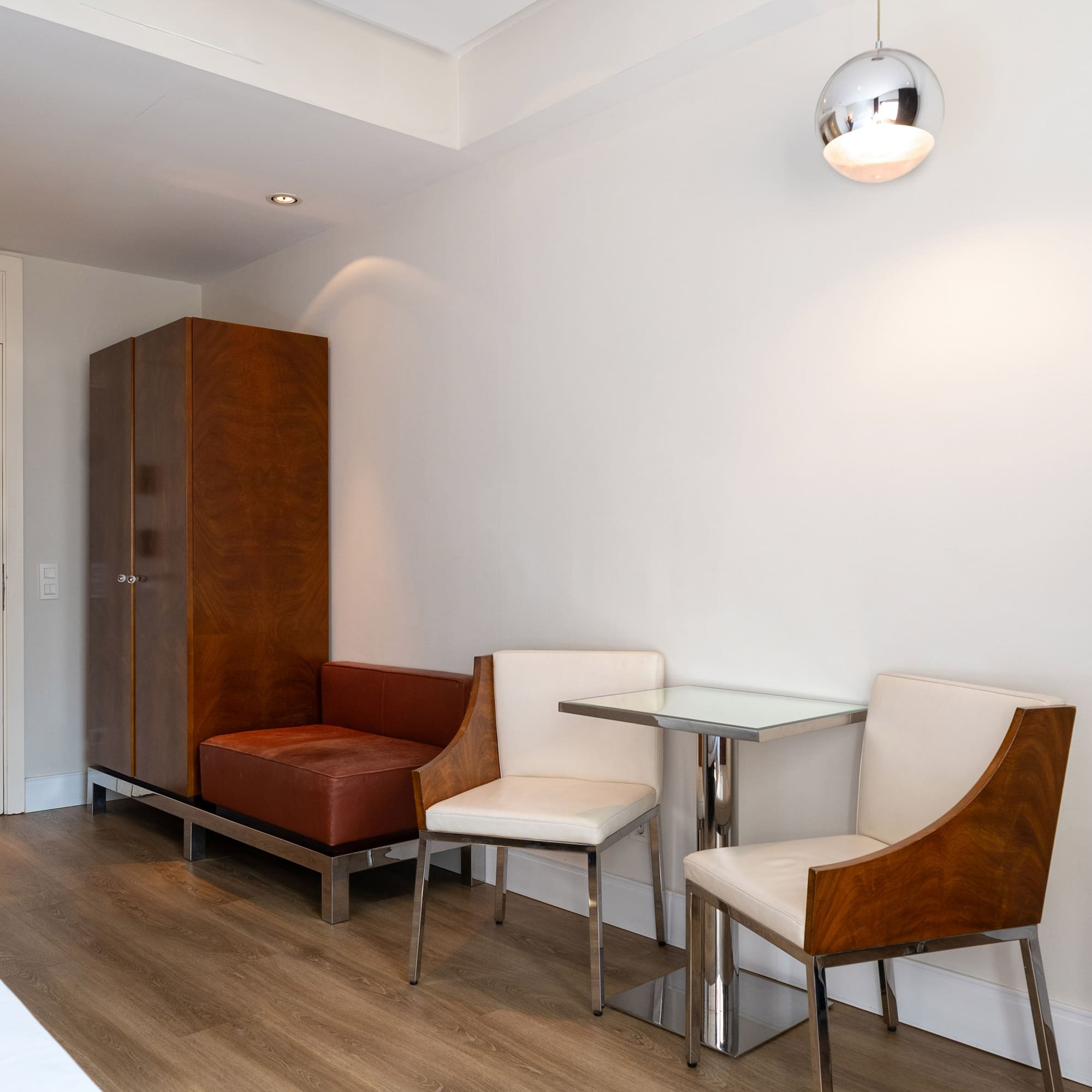 a room with a table and chairs