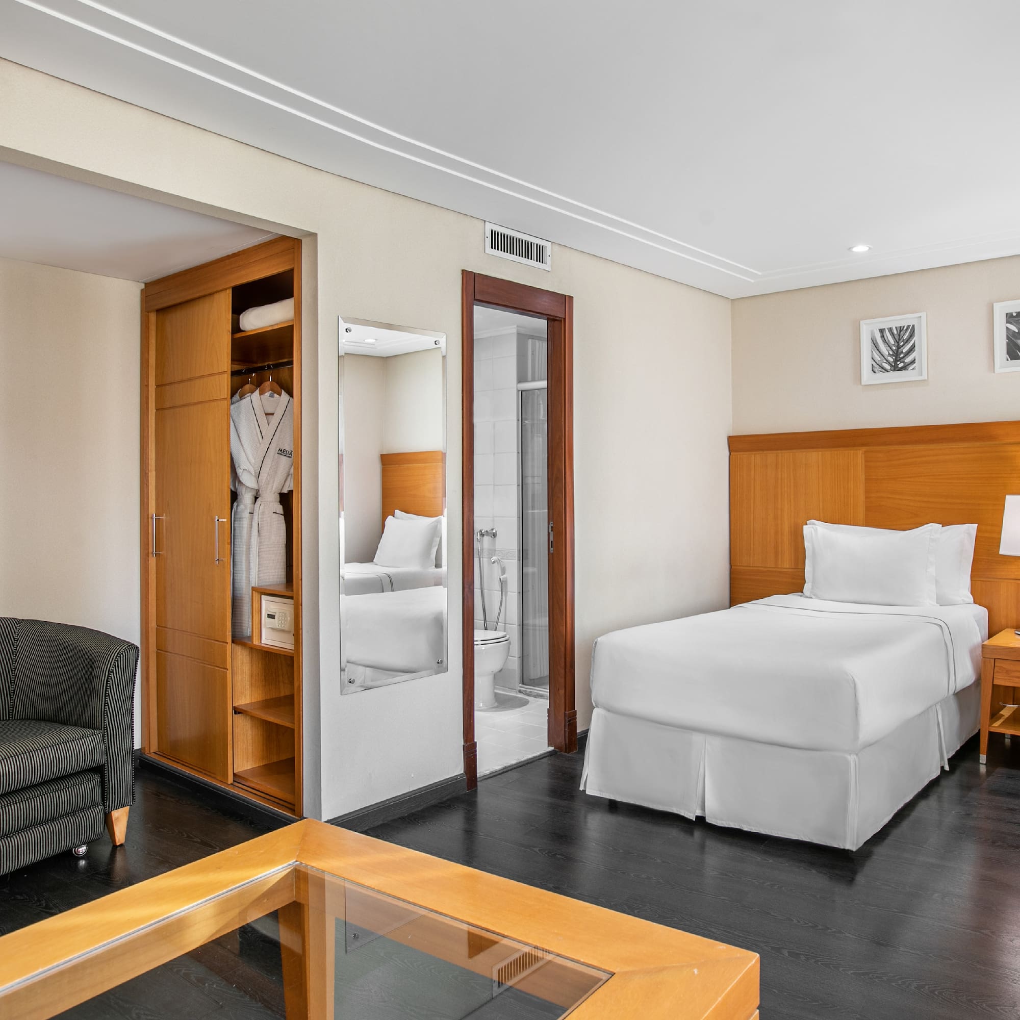 a room with a bed and a chair