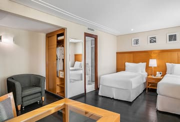 a room with a bed and a chair