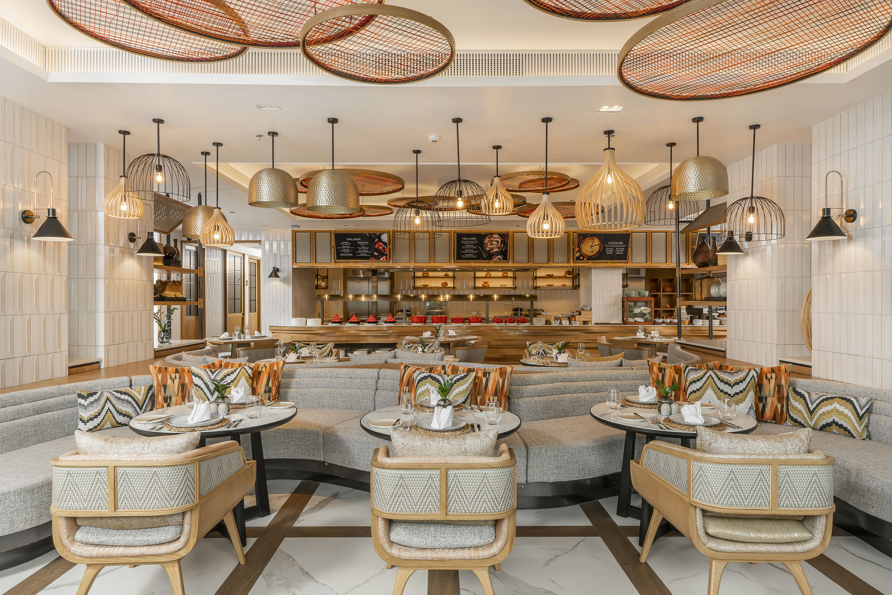 Modern restaurant dining area with stylish booth seating and buffet.