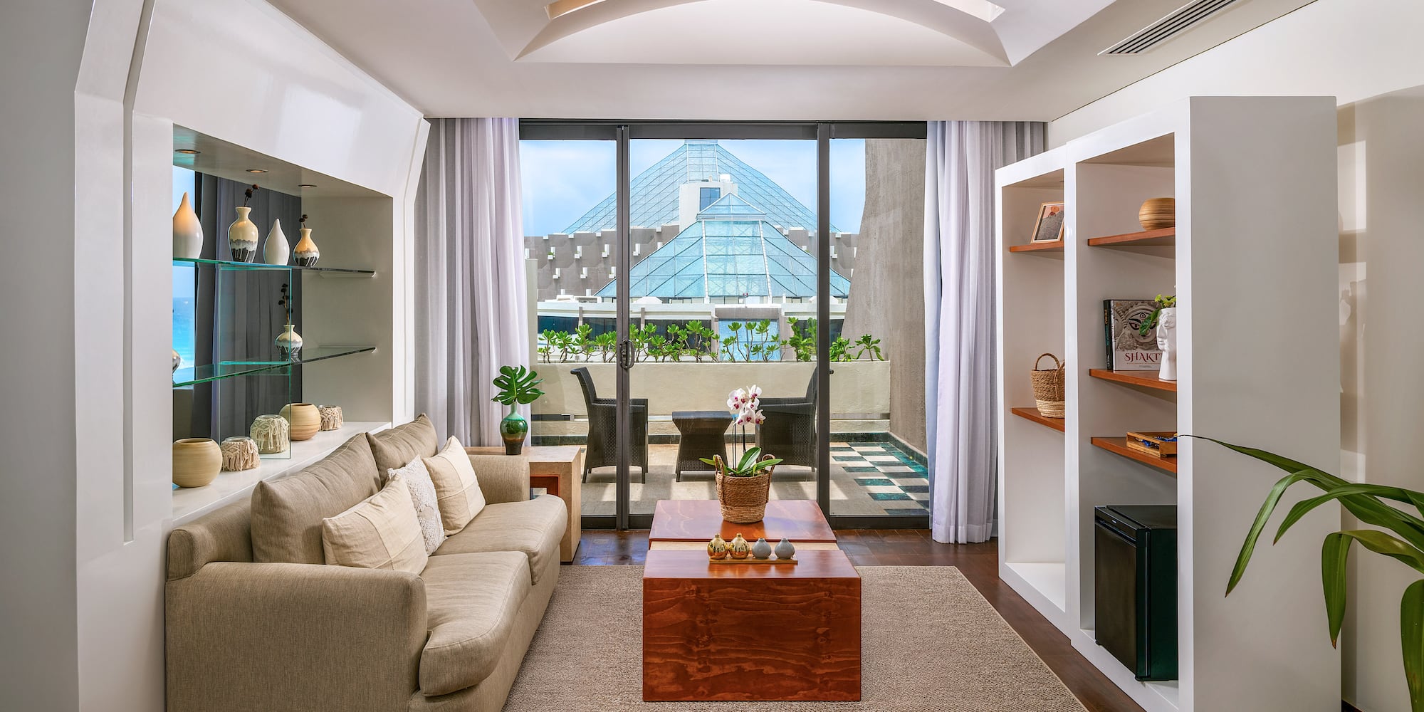 a living room with a couch and shelves
