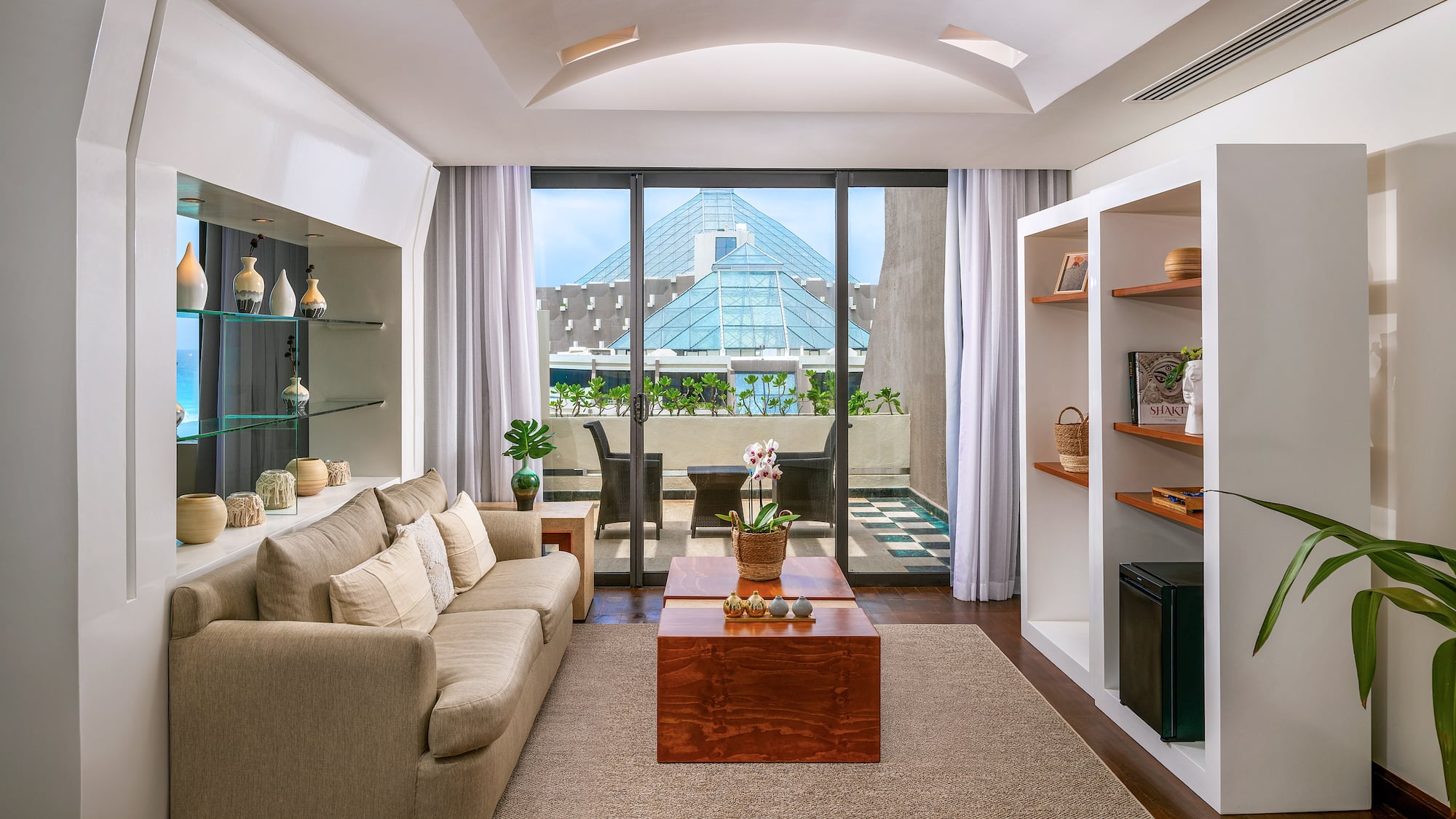 a living room with a couch and shelves