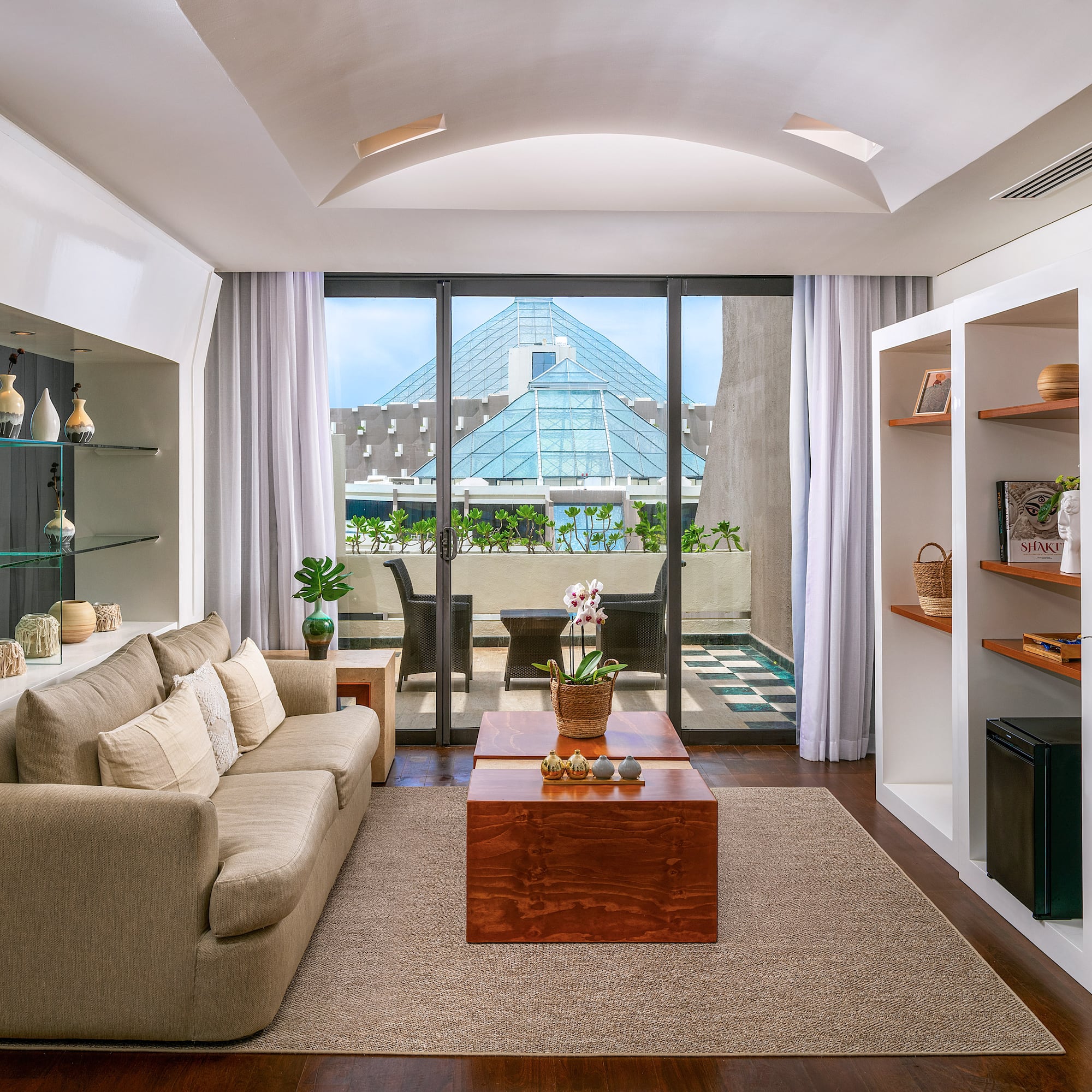 a living room with a couch and shelves