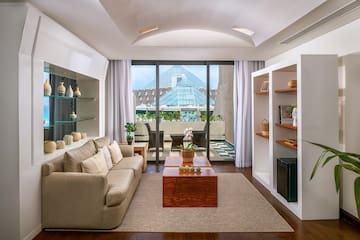 a living room with a couch and shelves