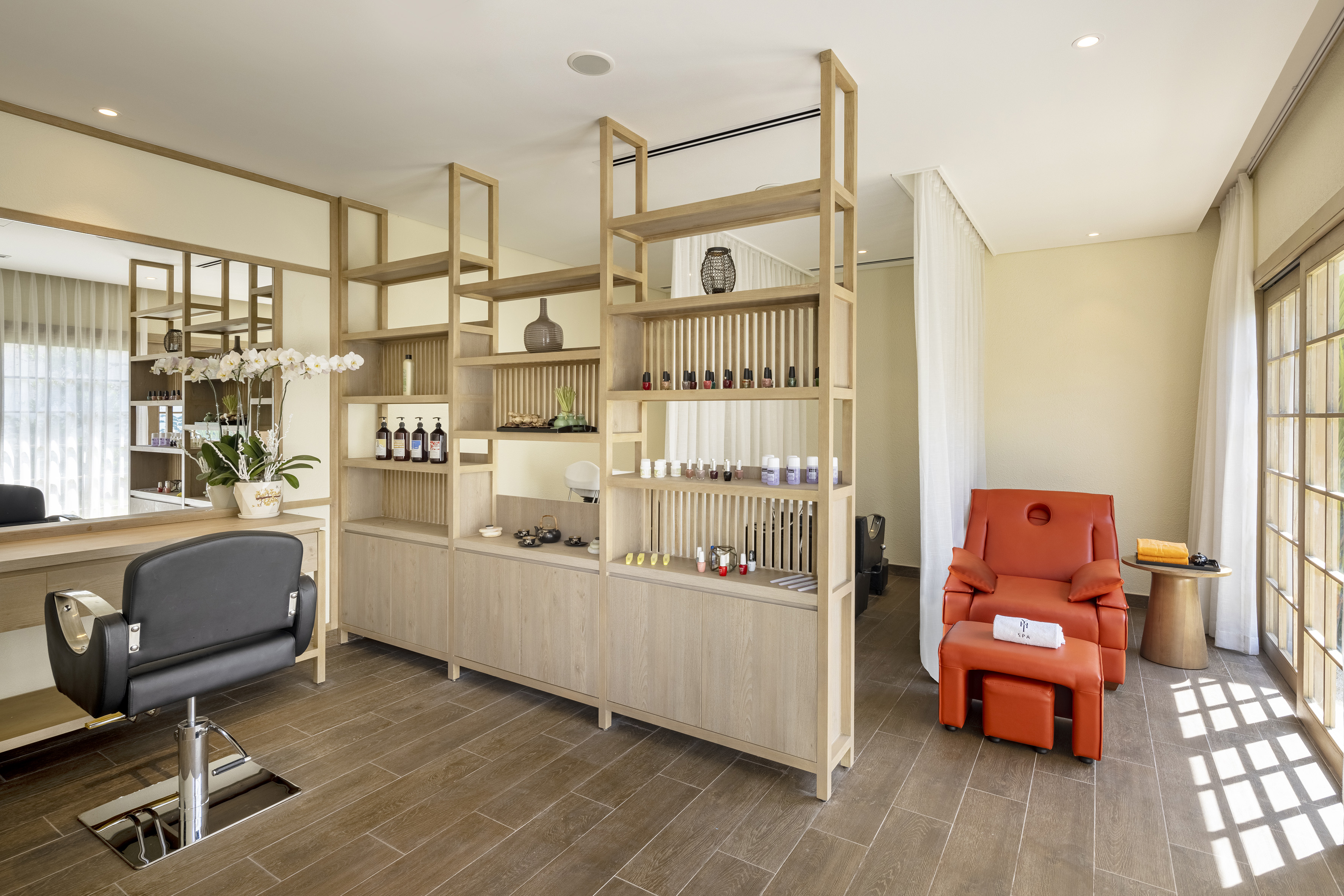 a room with shelves and a chair