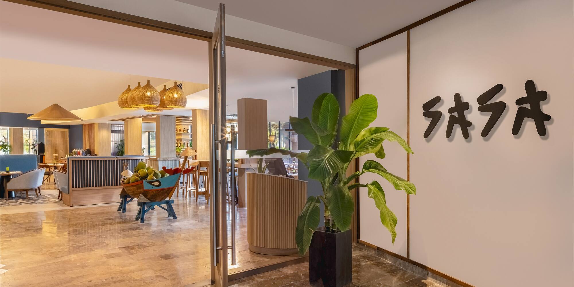 a glass door with a plant in it