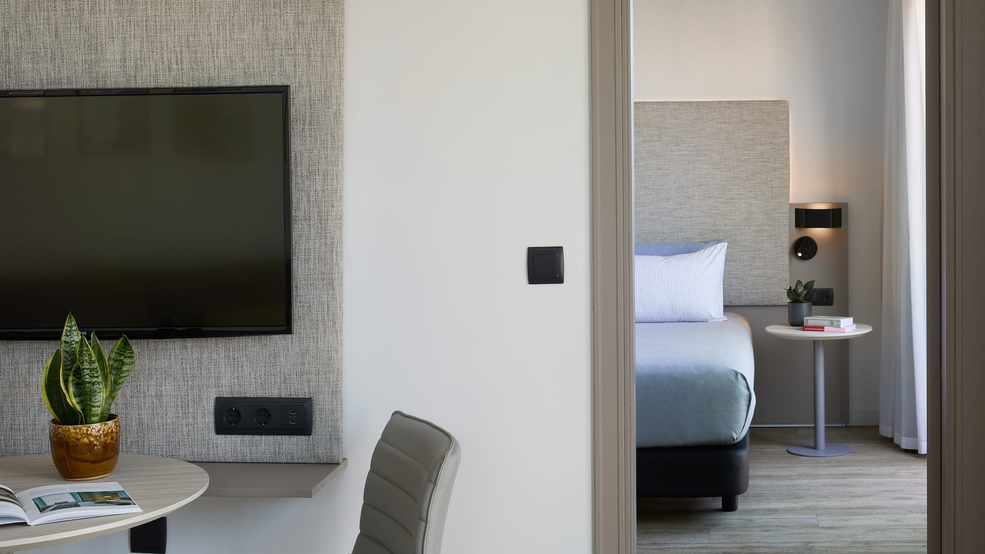 a room with a tv and a table