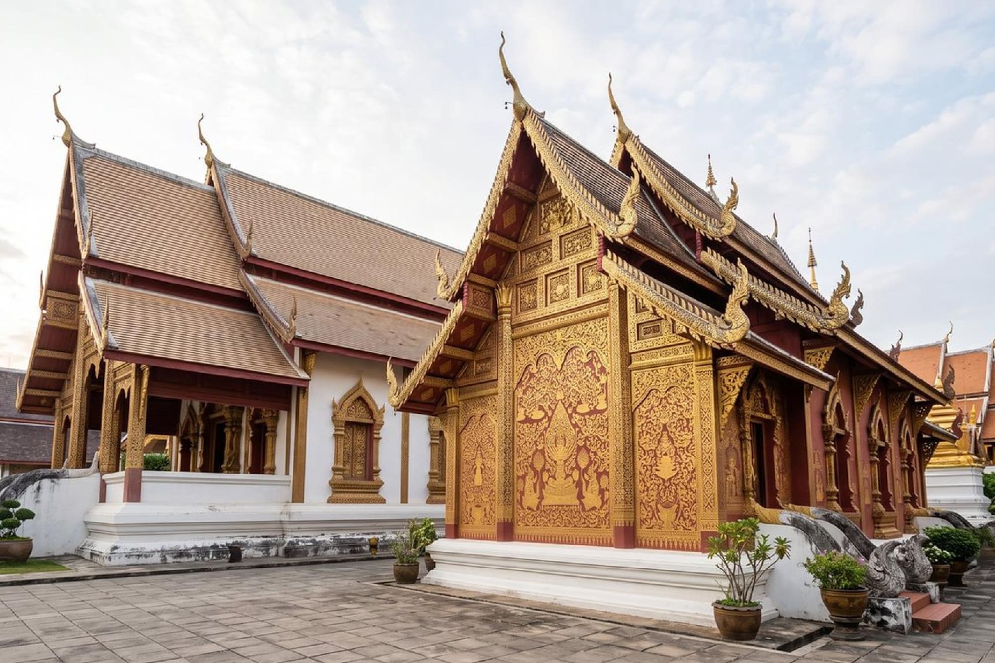 Golden Thai temple with intricate carvings and traditional architecture.