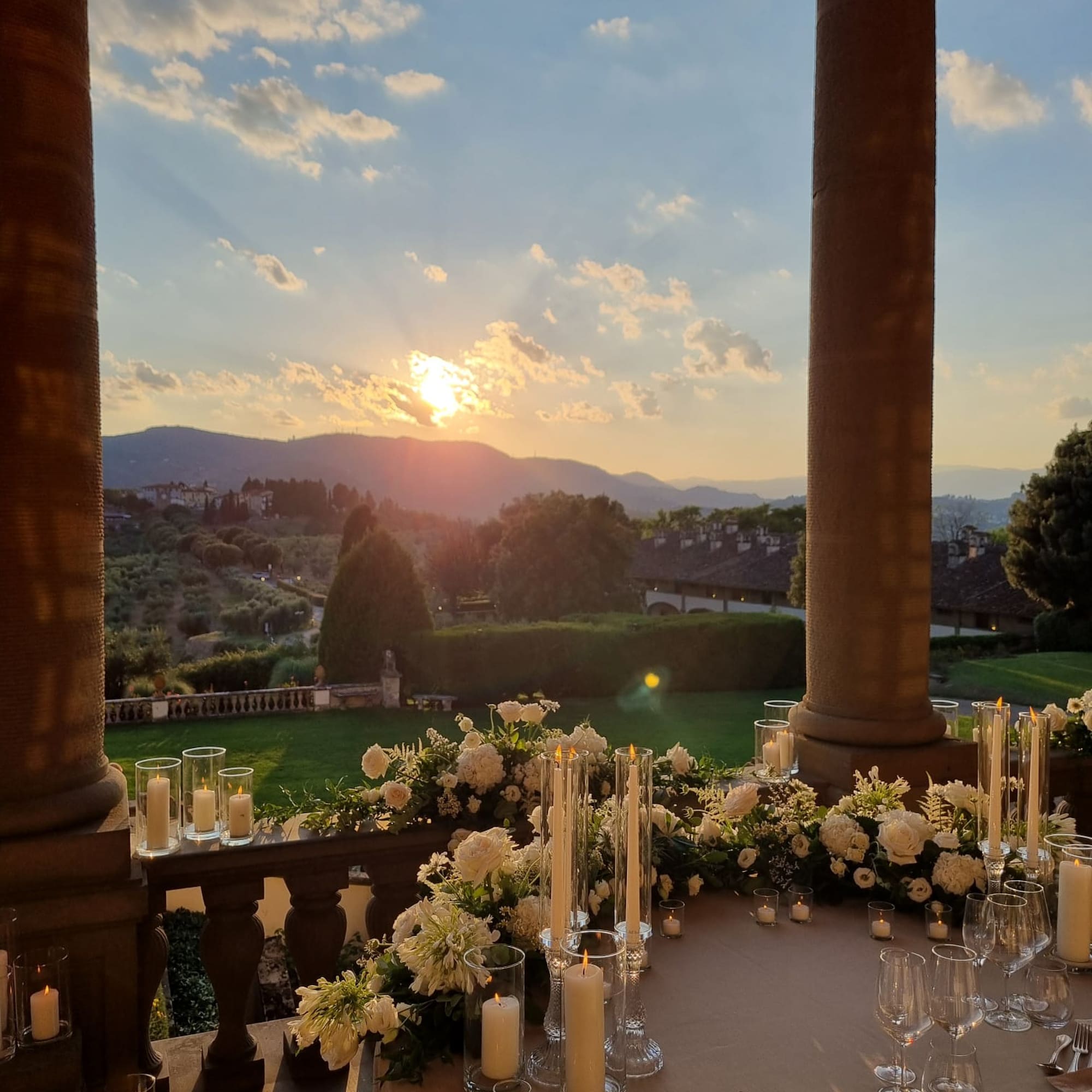 a table with candles and flowers on it