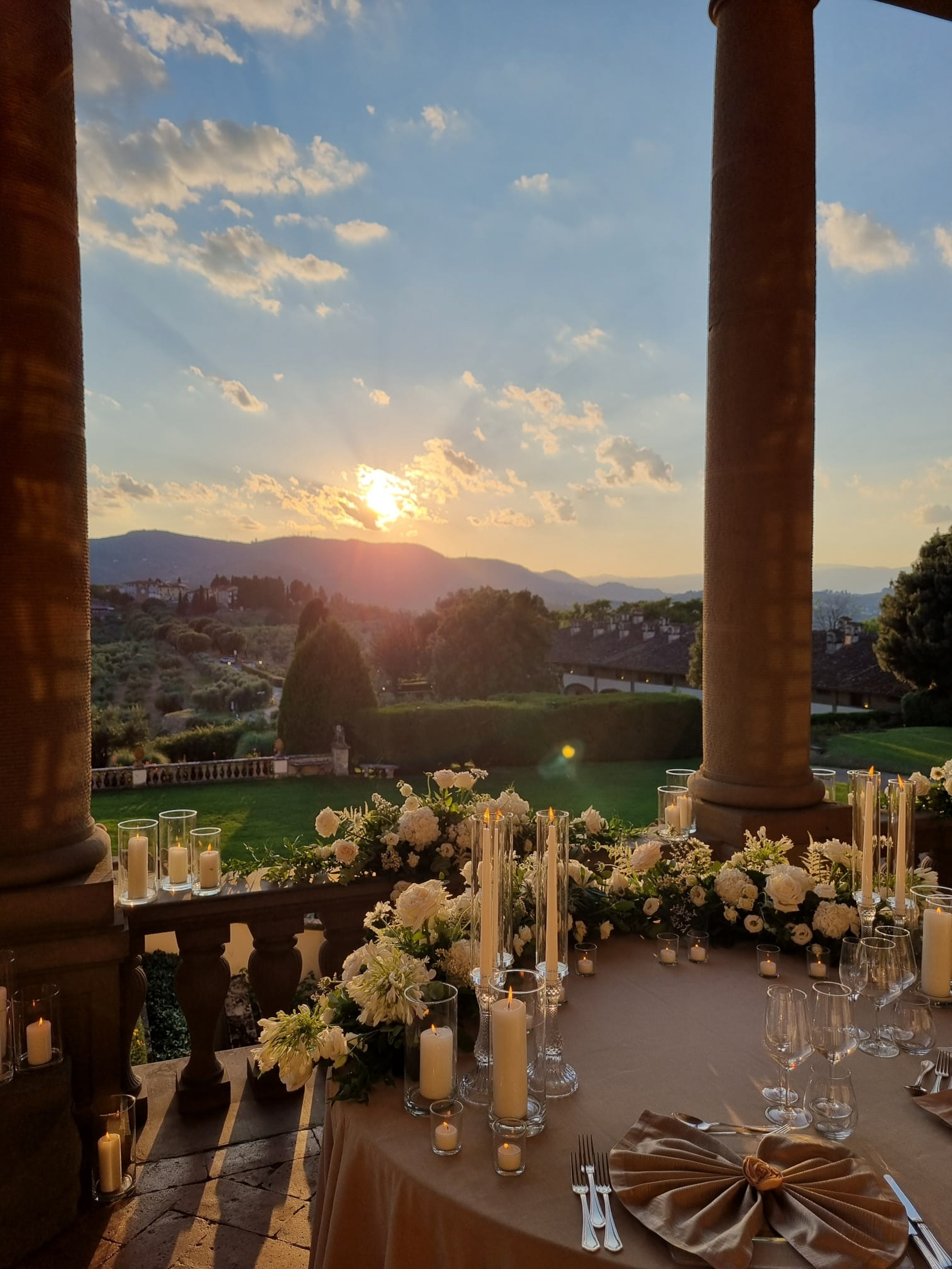 a table with candles and flowers on it