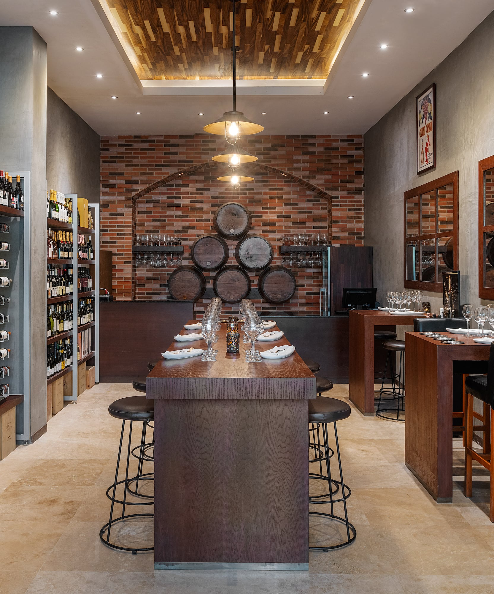 a room with a bar and wine bottles