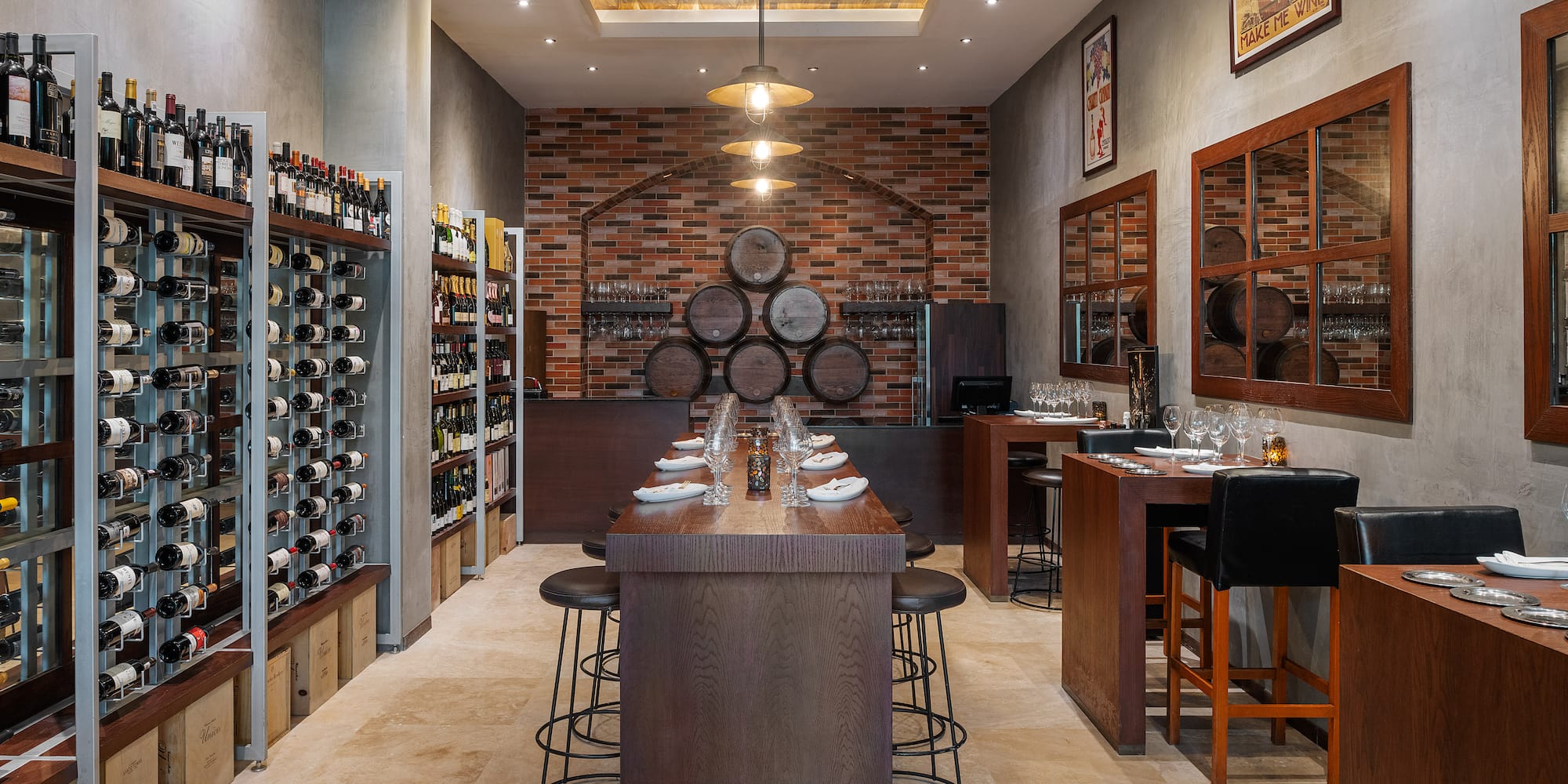 a room with a bar and wine bottles