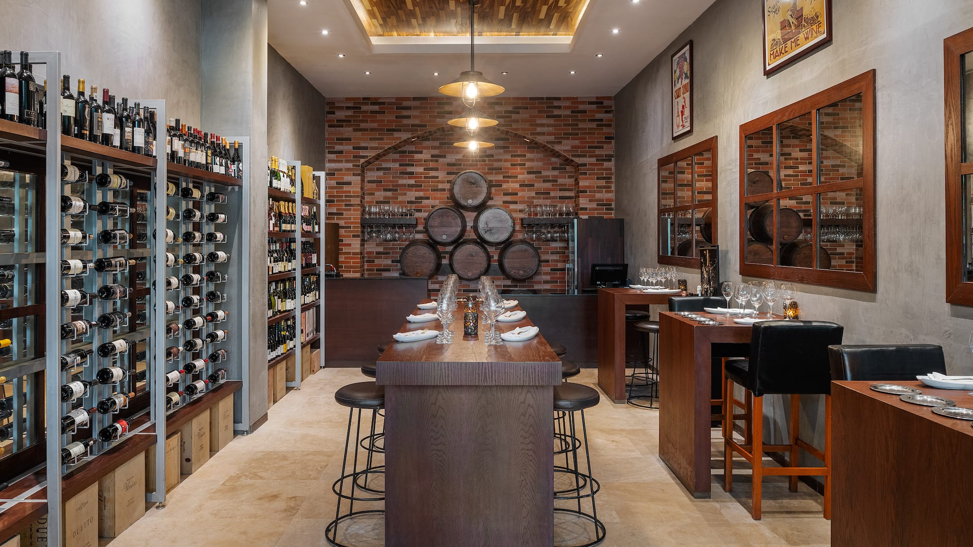 a room with a bar and wine bottles