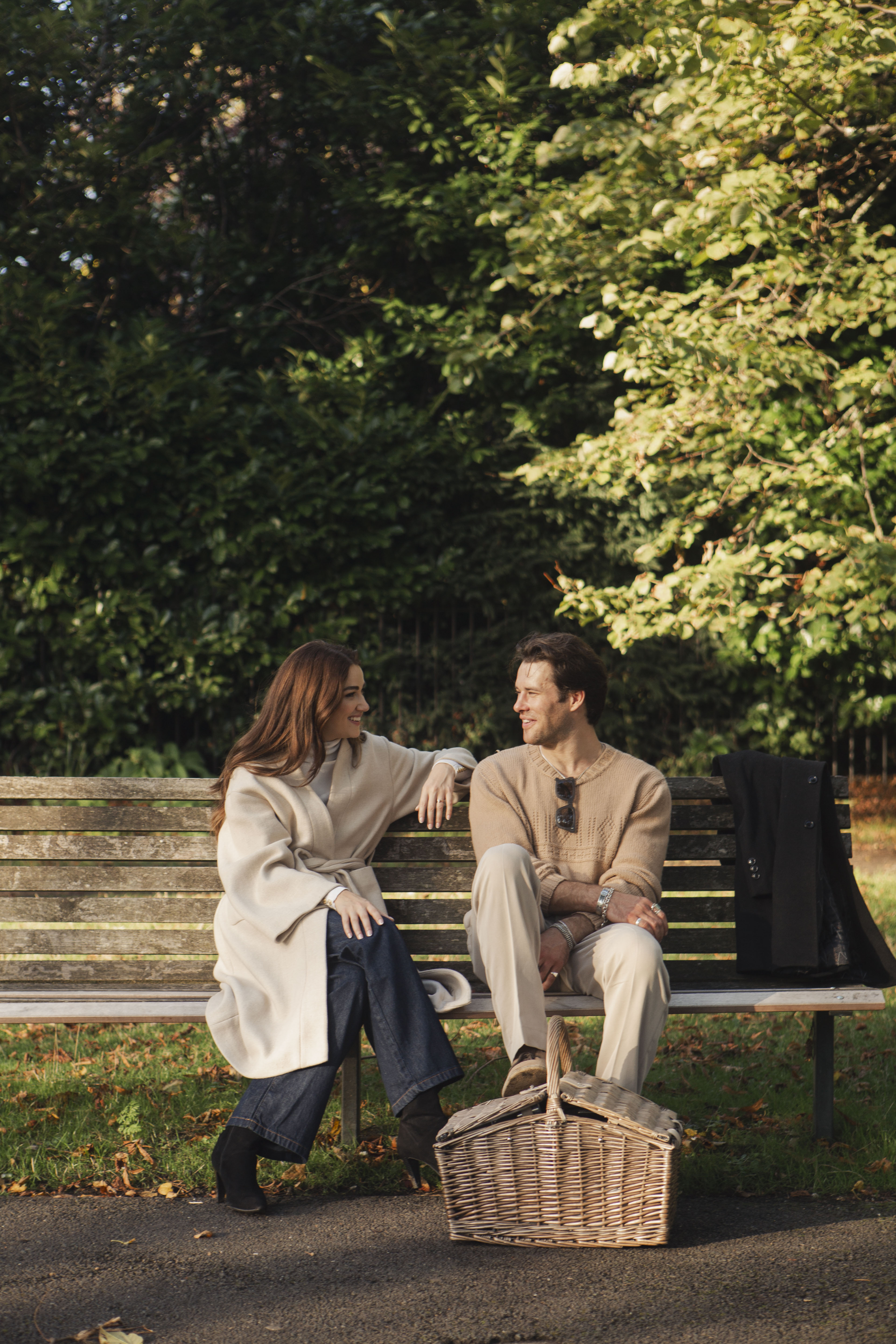a man and woman sitting on a bench