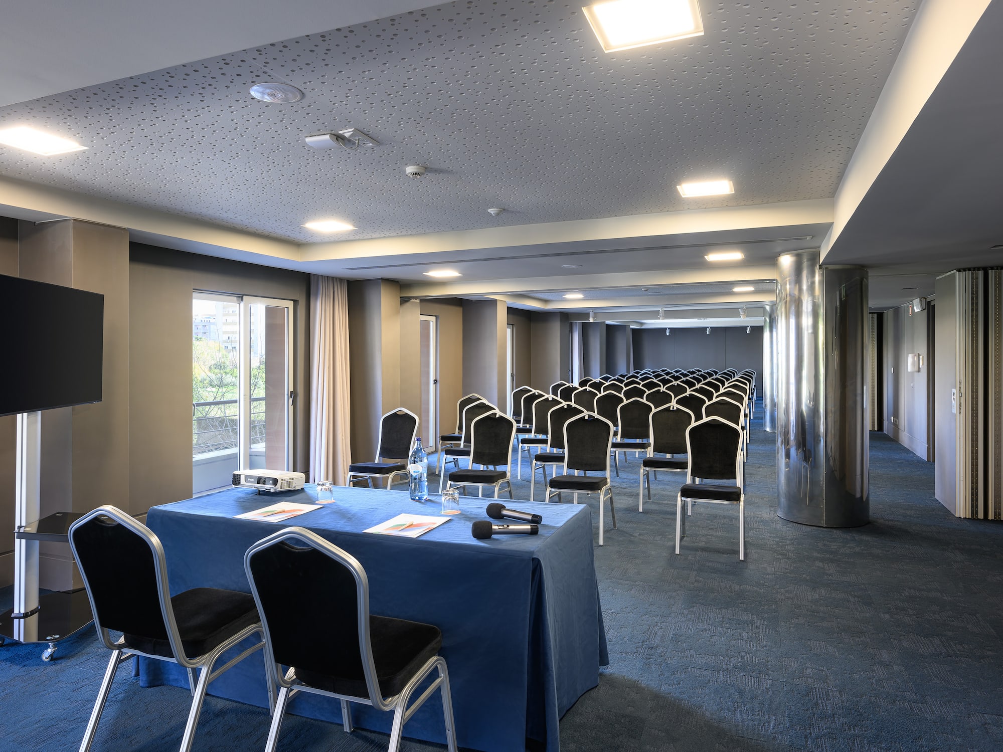 a room with chairs and tables