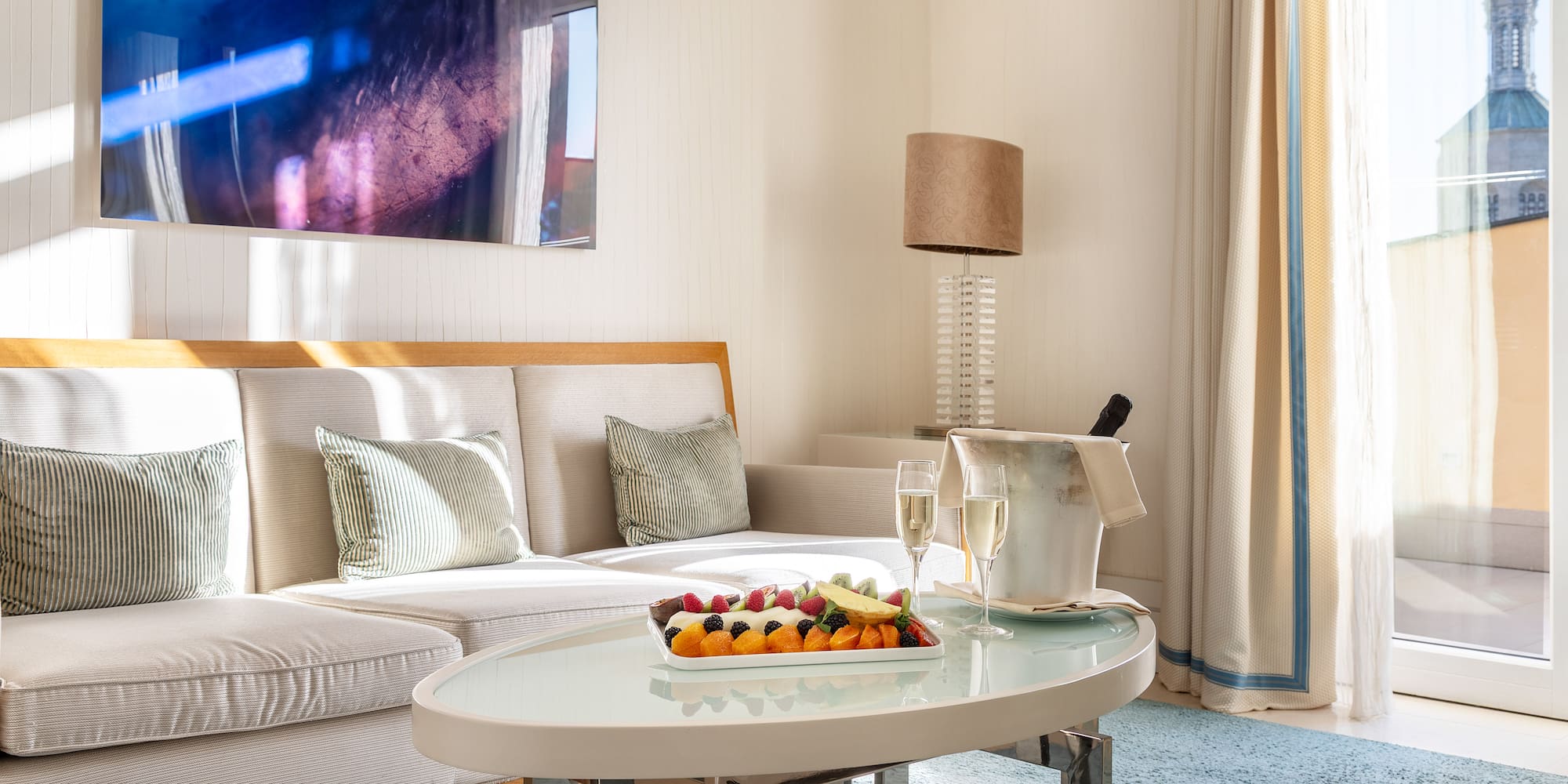 a room with a couch and a table with food on it