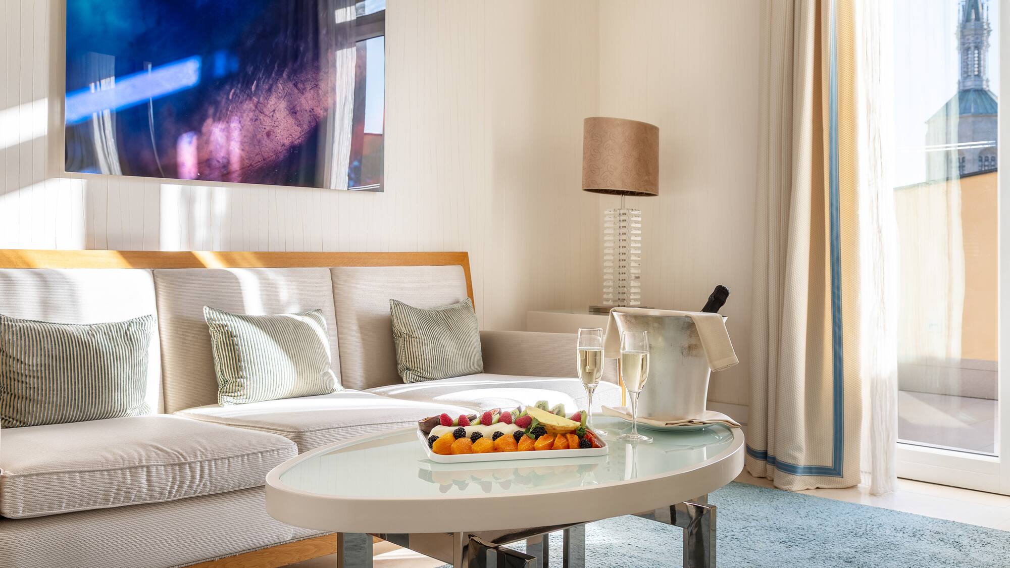 a room with a couch and a table with food on it