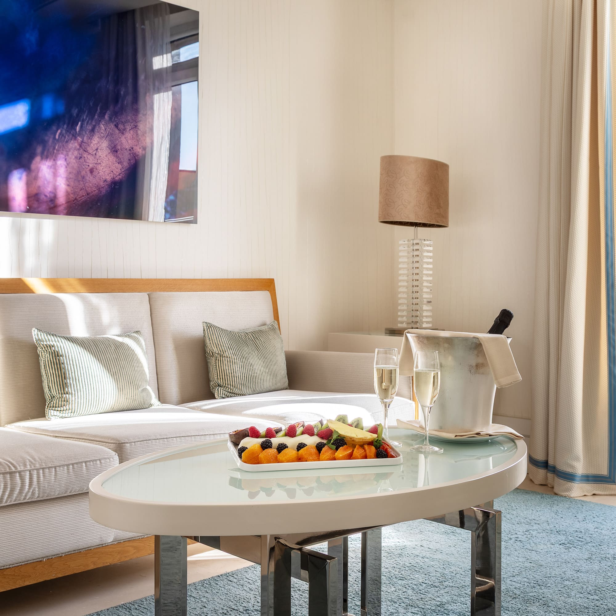 a room with a couch and a table with food on it