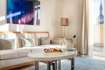 a room with a couch and a table with food on it