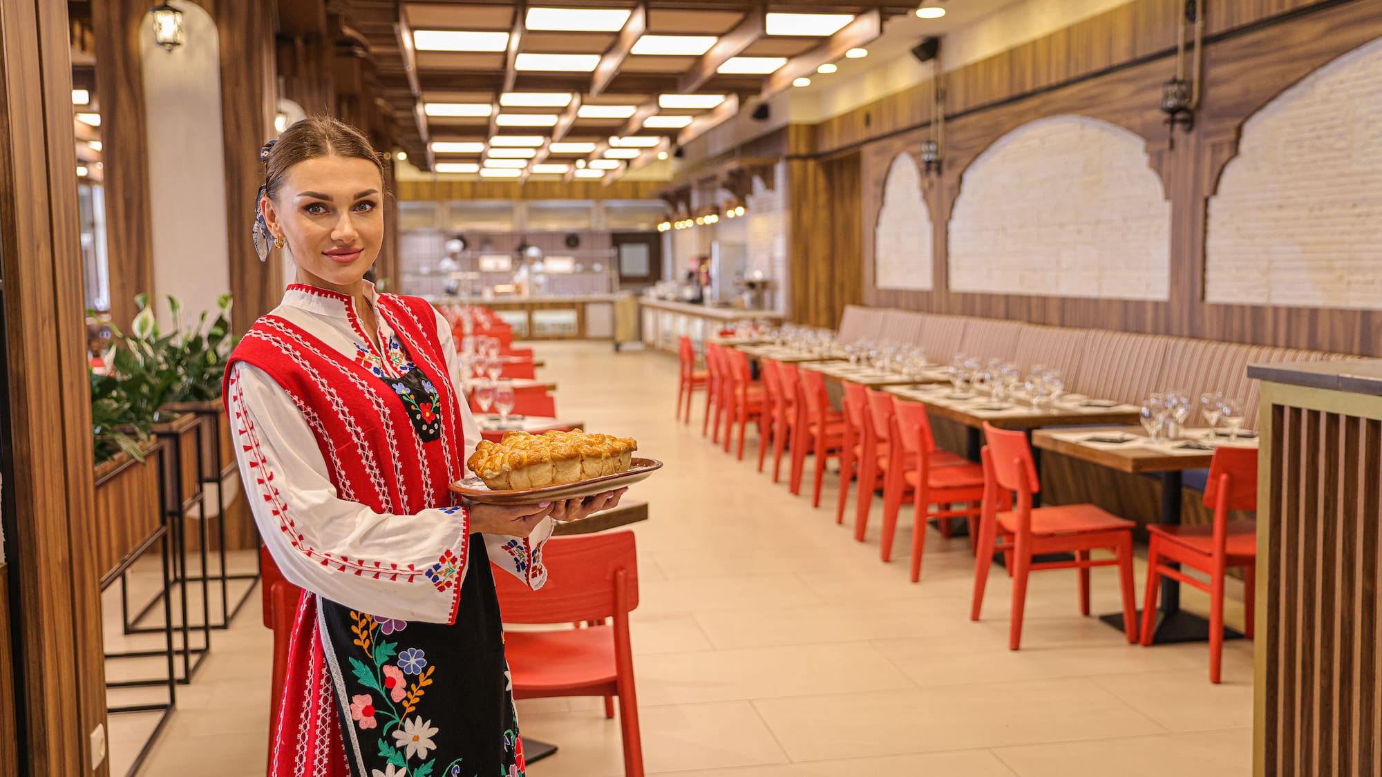 a woman holding a plate of food